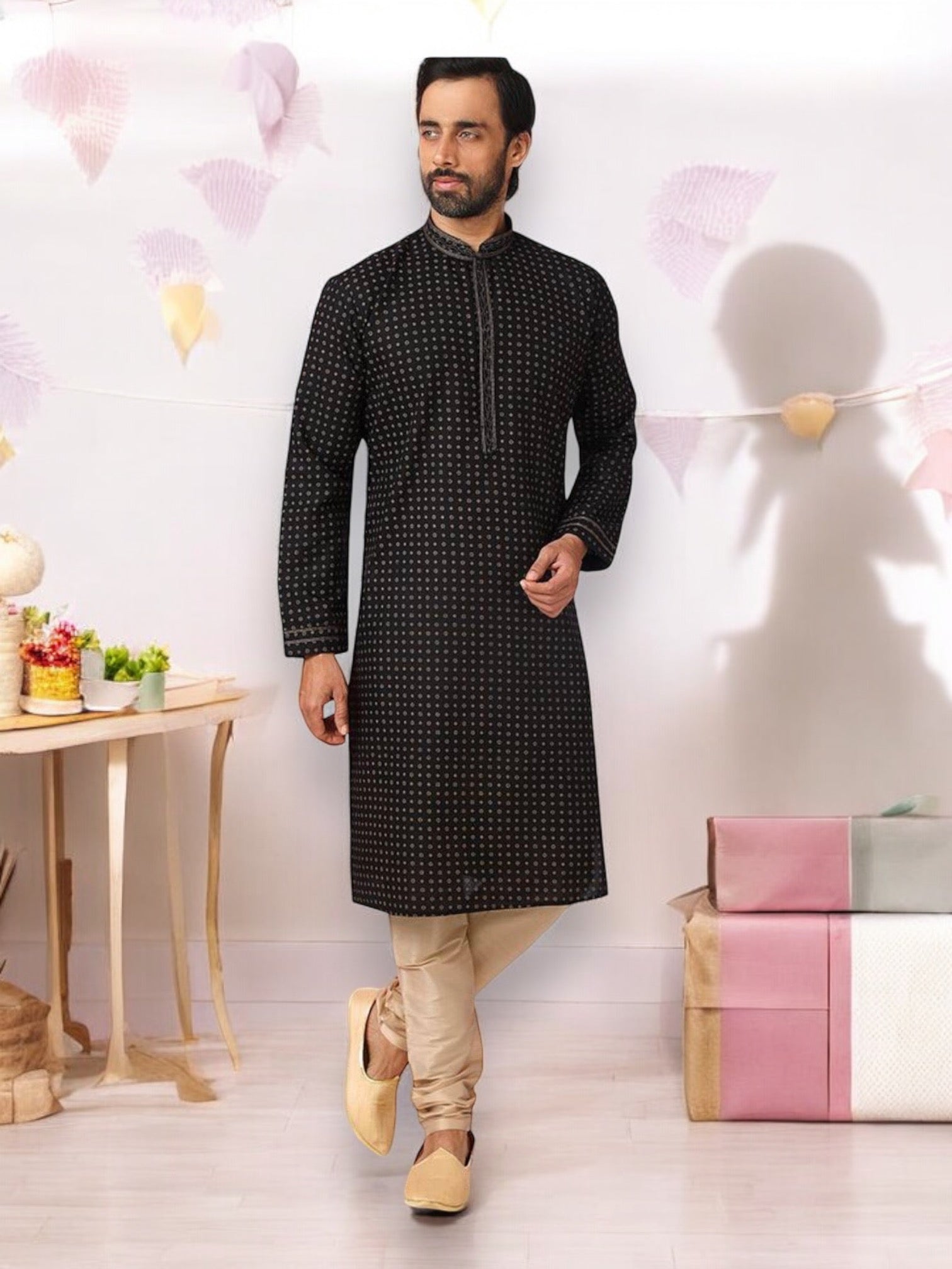 Black cotton men's kurta with matching pajama set by Saree Ghor Charlotte, traditional ethnic wear for men.