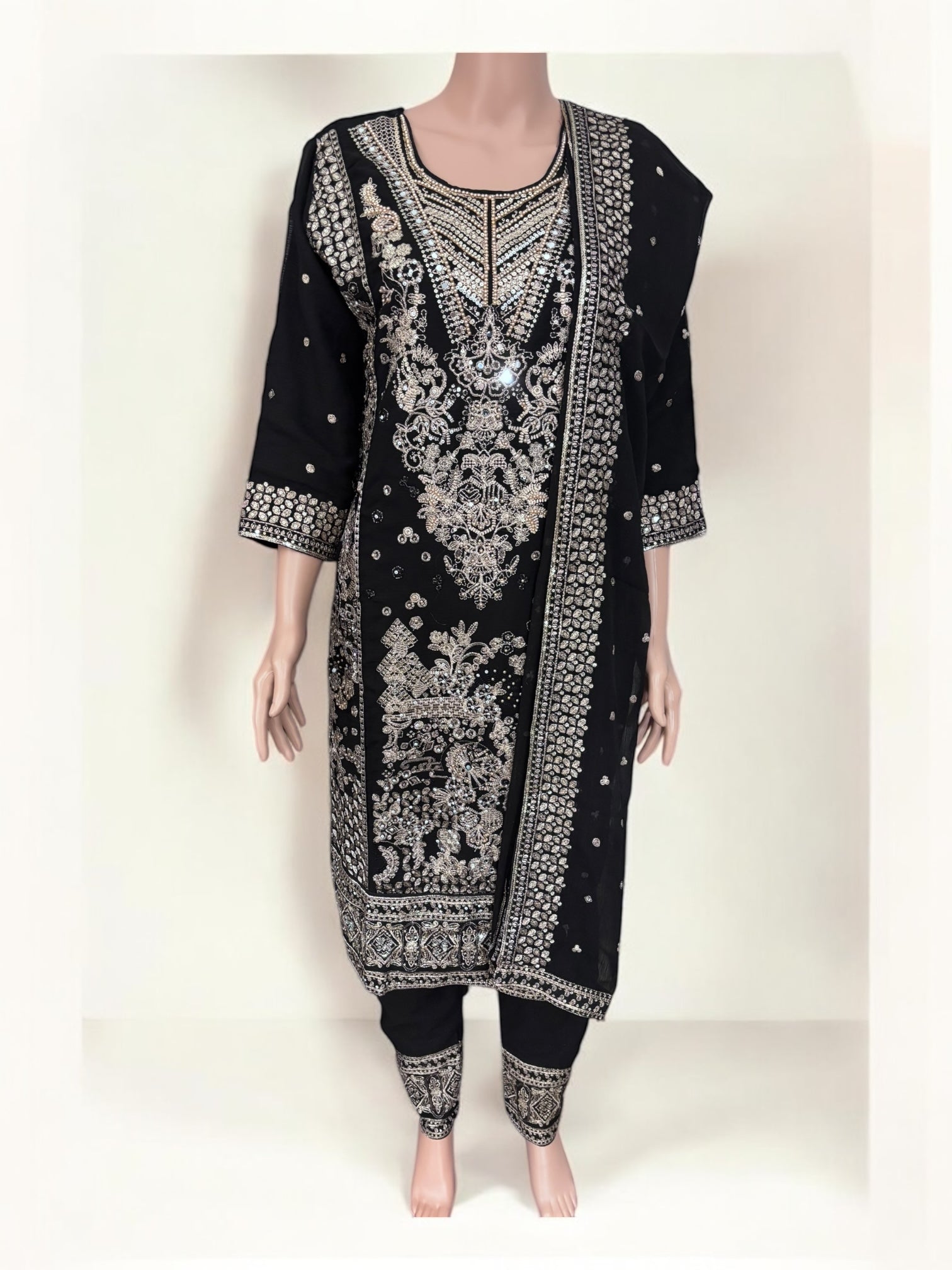 Black traditional designer Salwar Kameez suit by Saree Ghor Charlotte, ethnic wear for women with intricate detailing.