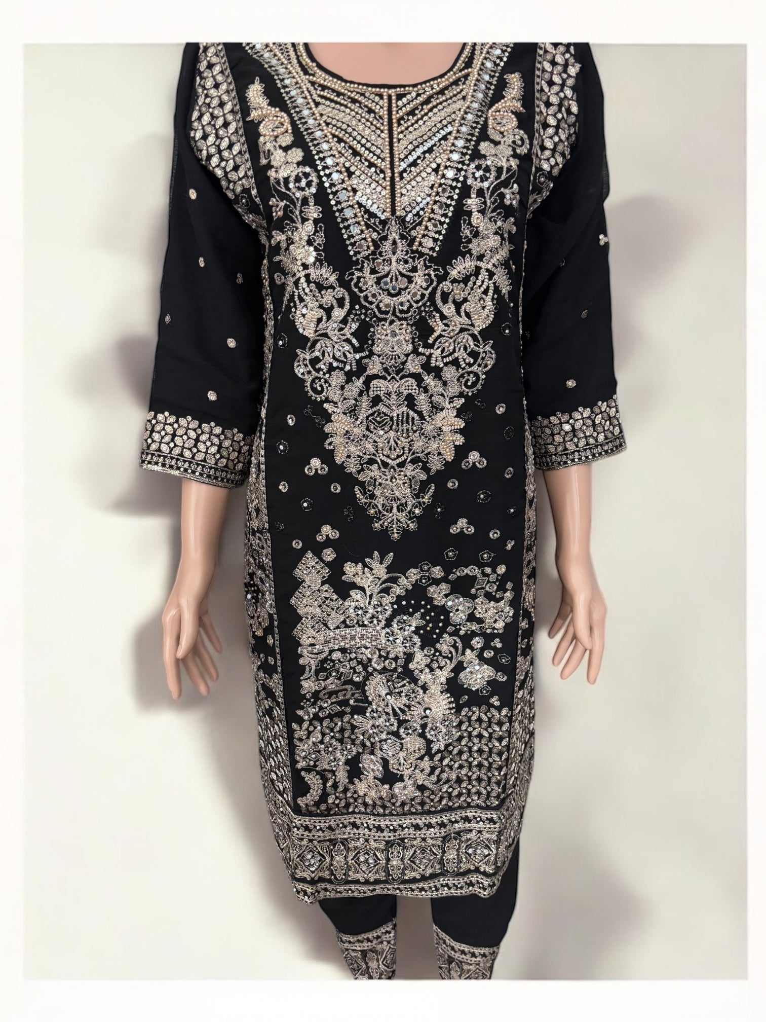 Black traditional designer Salwar Kameez suit by Saree Ghor Charlotte, ethnic wear for women, featuring intricate embroidery and elegant fabric.
