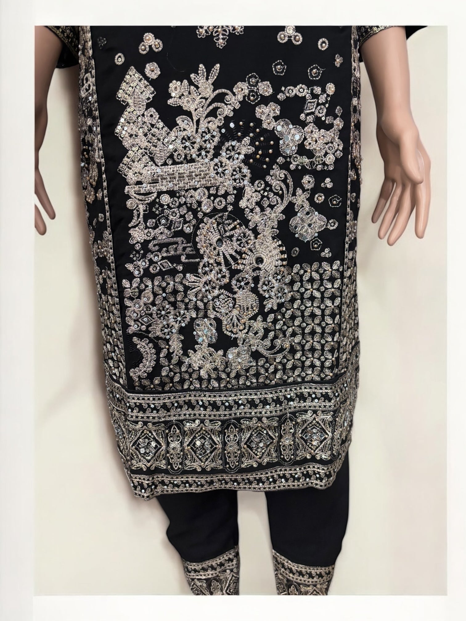 Black traditional designer Salwar Kameez suit for women by Saree Ghor Charlotte, showcasing intricate ethnic wear with elegant detailing.