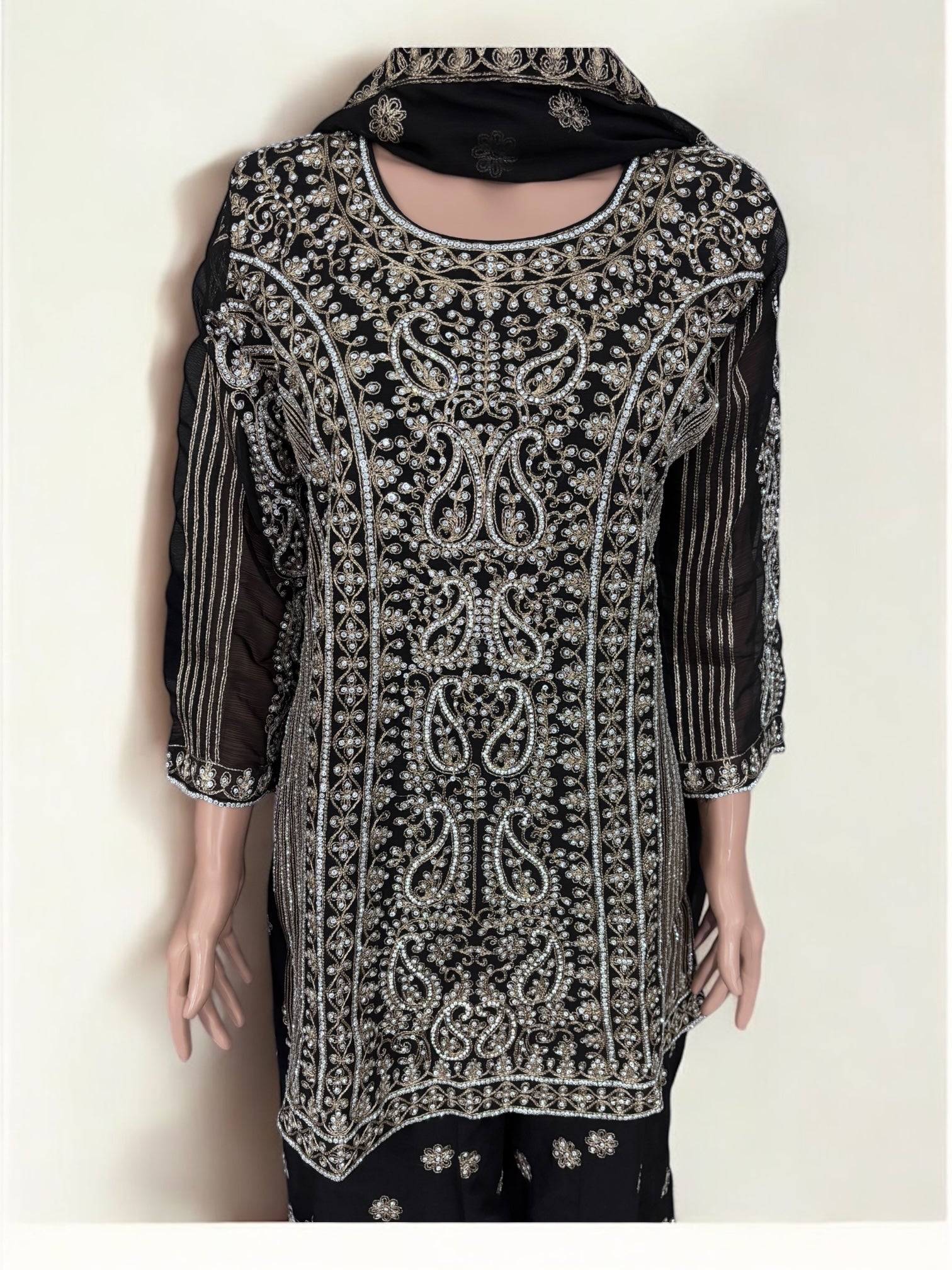 Black traditional designer Sharara Salwar Kameez suit for women, ethnic wear by Saree Ghor Charlotte with intricate embroidery details.