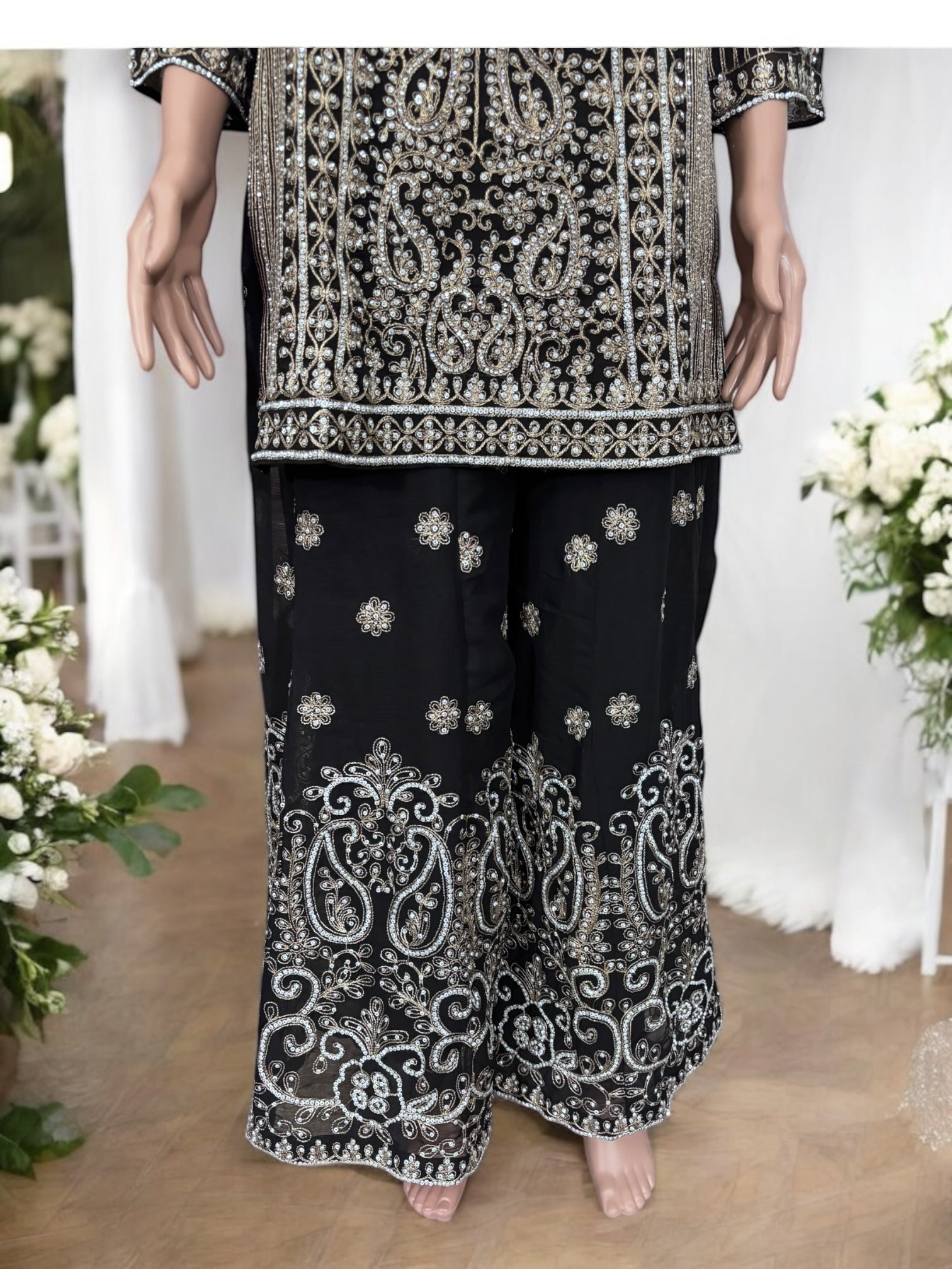 Black traditional designer Sharara Salwar Kameez suit by Saree Ghor Charlotte, featuring intricate embroidery and ethnic styling for women.