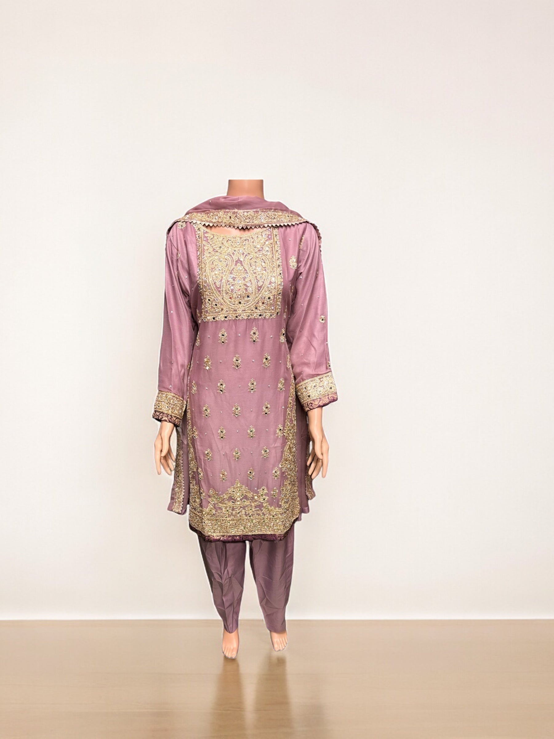 Elegant designer party wear Salwar Kameez set by Saree Ghor Charlotte, featuring vibrant ethnic attire for women.