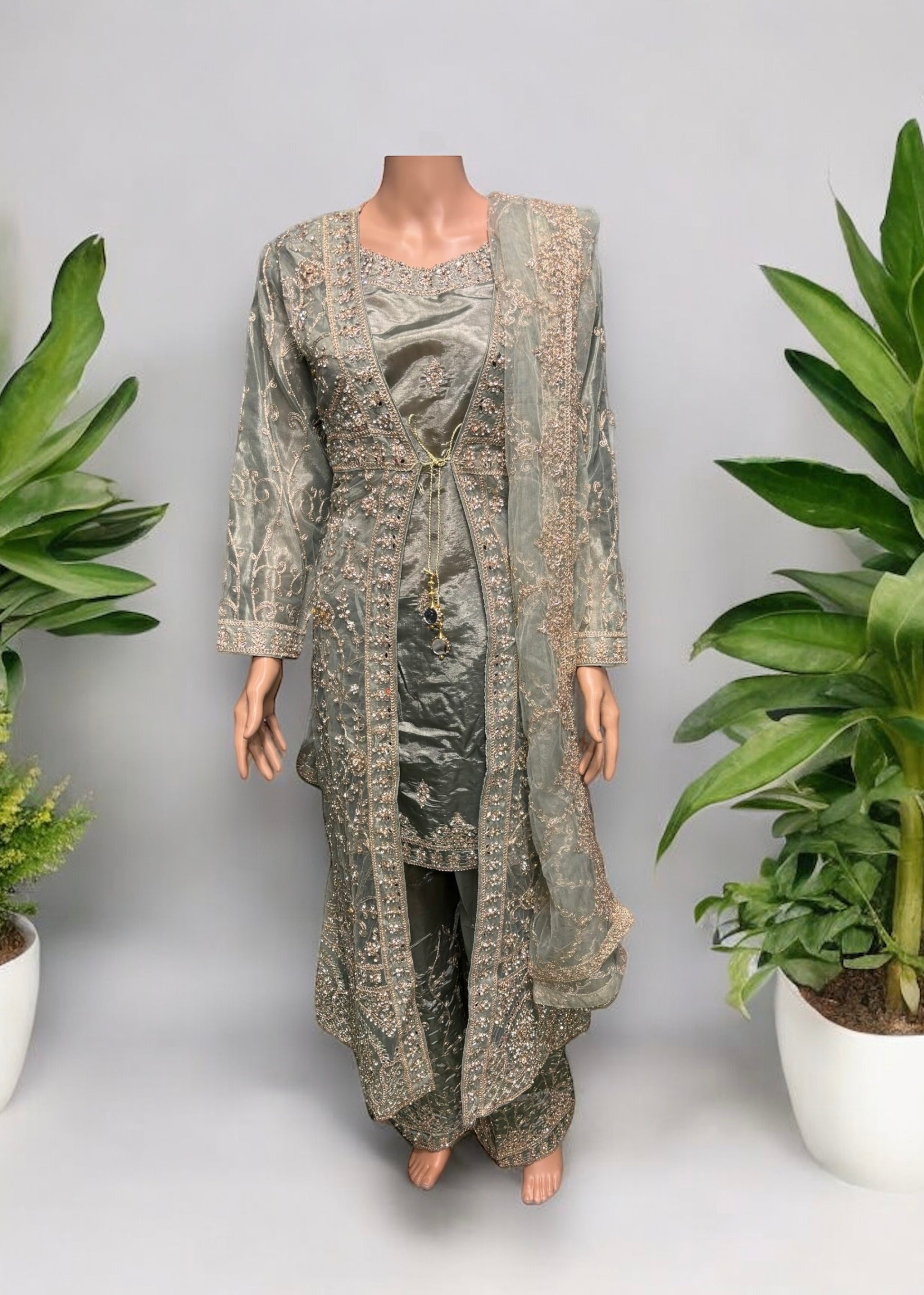 Designer party wear Salwar Kameez set by Saree Ghor Charlotte, featuring intricate embroidery and vibrant fabric for women.