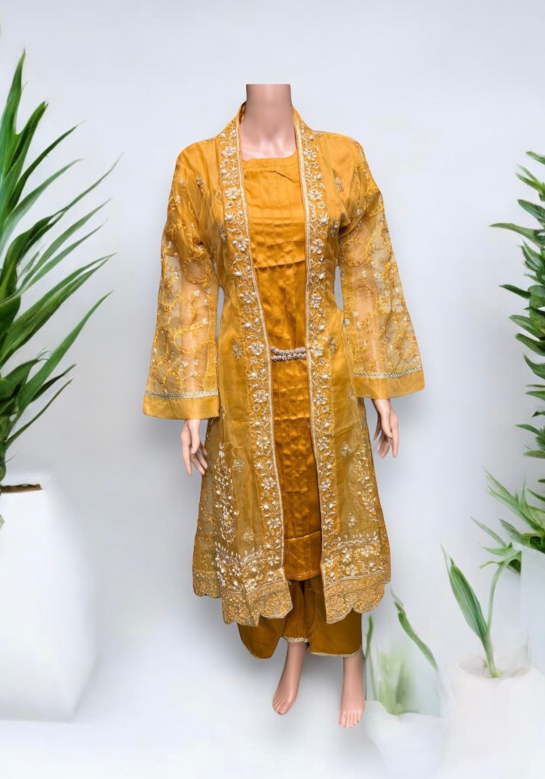 Designer party wear Salwar Kameez set by Saree Ghor Charlotte, elegant ethnic wear for women with intricate embroidery and vibrant colors.