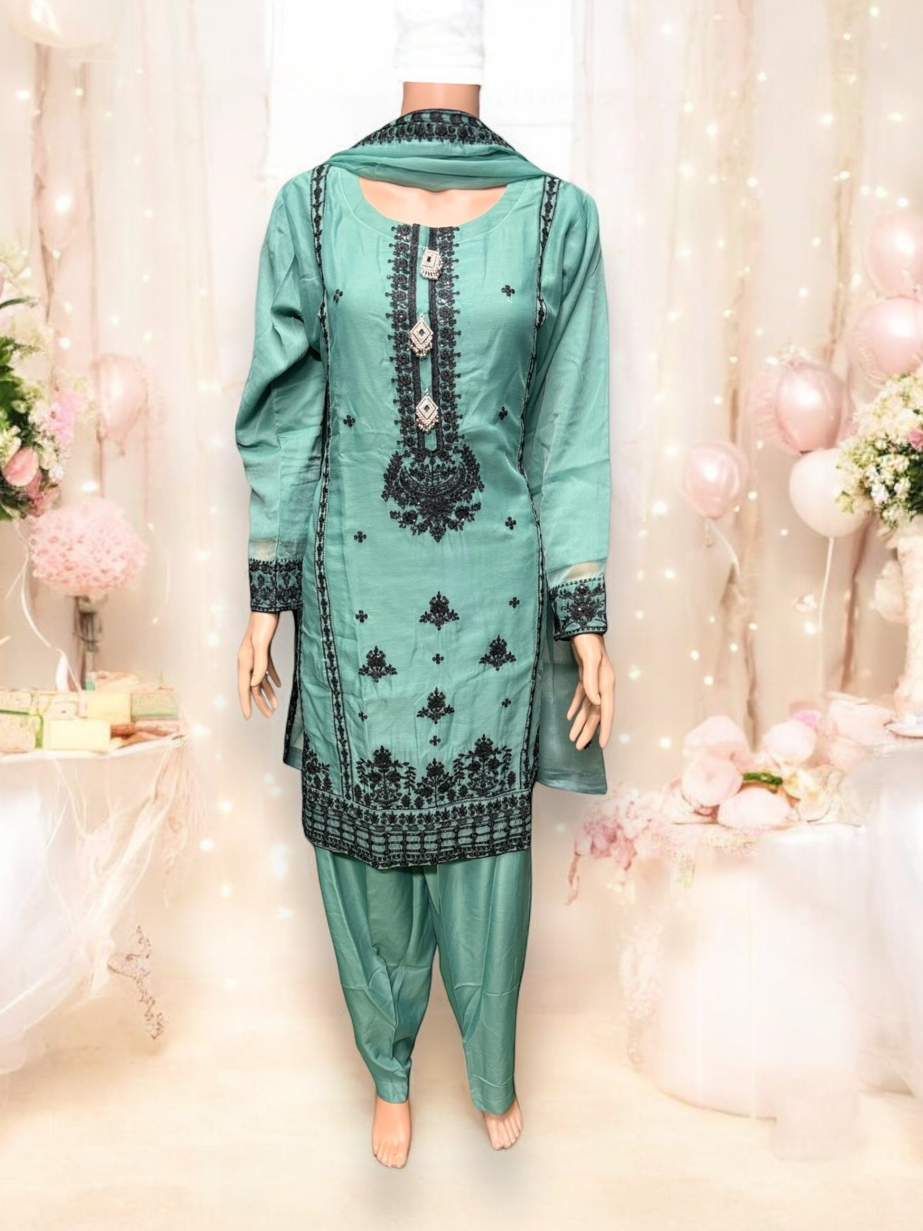 Designer party wear Salwar Kameez set by Saree Ghor Charlotte, featuring elegant traditional attire for women.