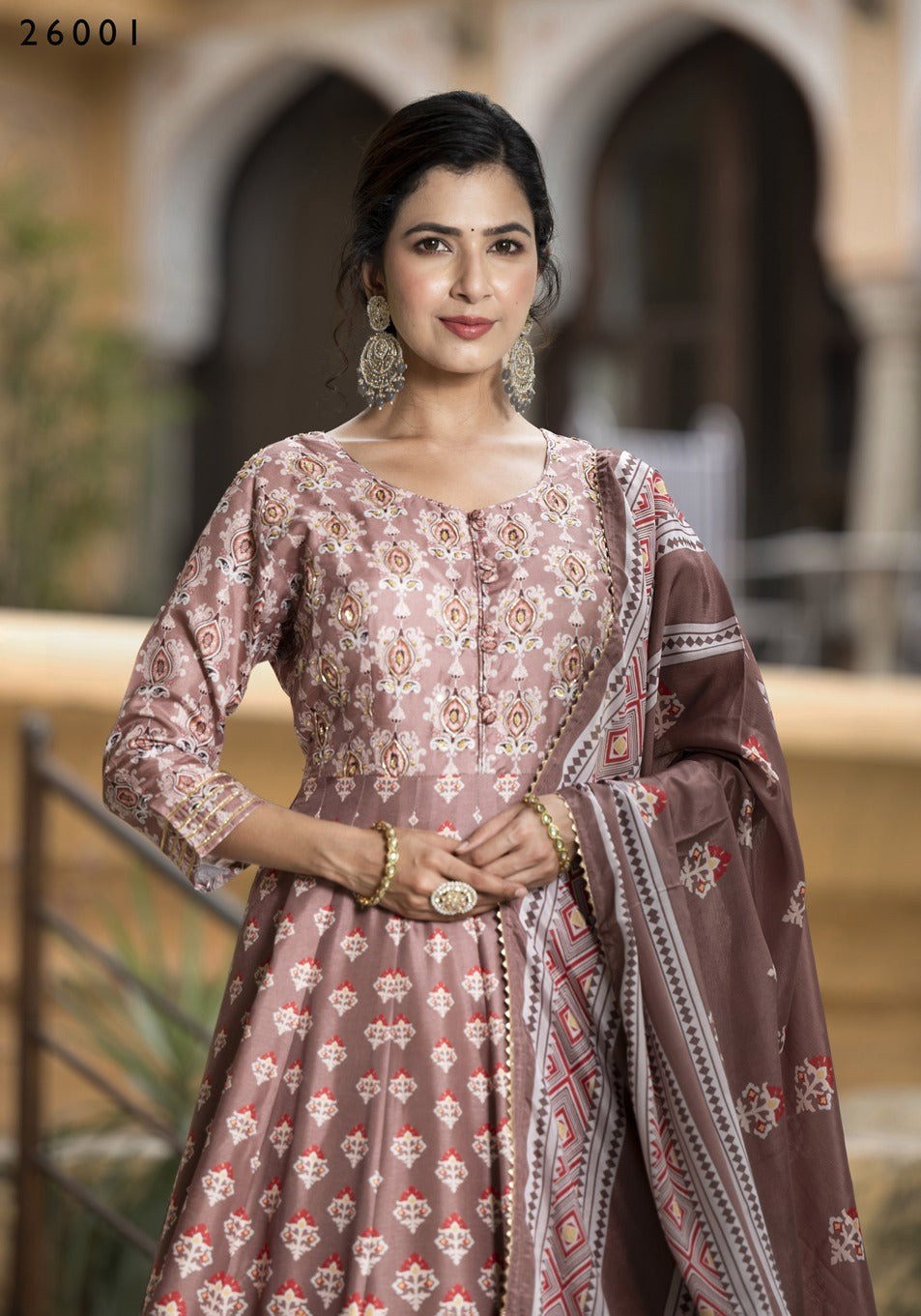 Dola Silk printed traditional designer salwar kameez for women featuring intricate ethnic embroidery and vibrant colors.