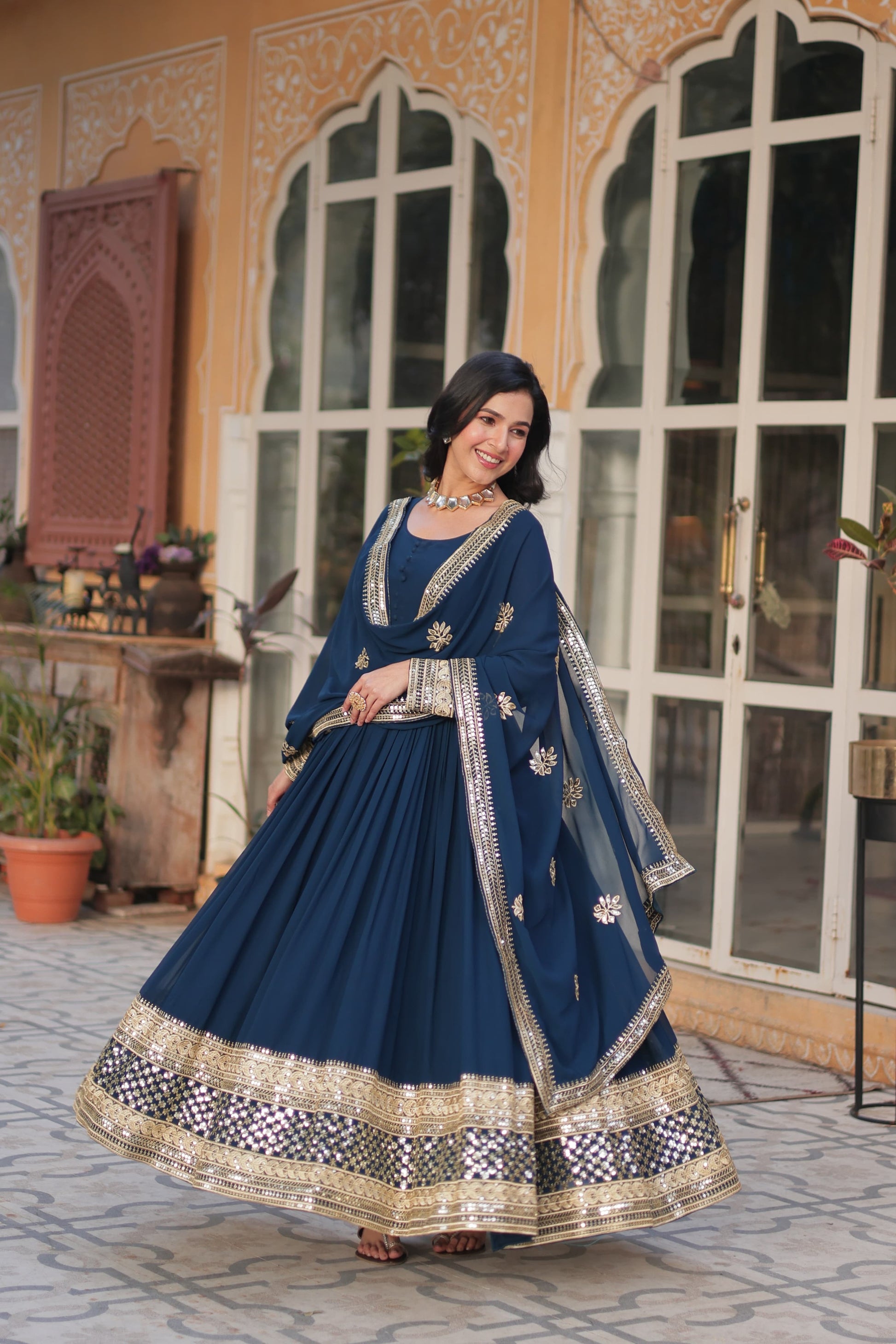 Faux blooming traditional designer Salwar Kameez gown by Saree Ghor Charlotte, ethnic wear for women with intricate floral details.
