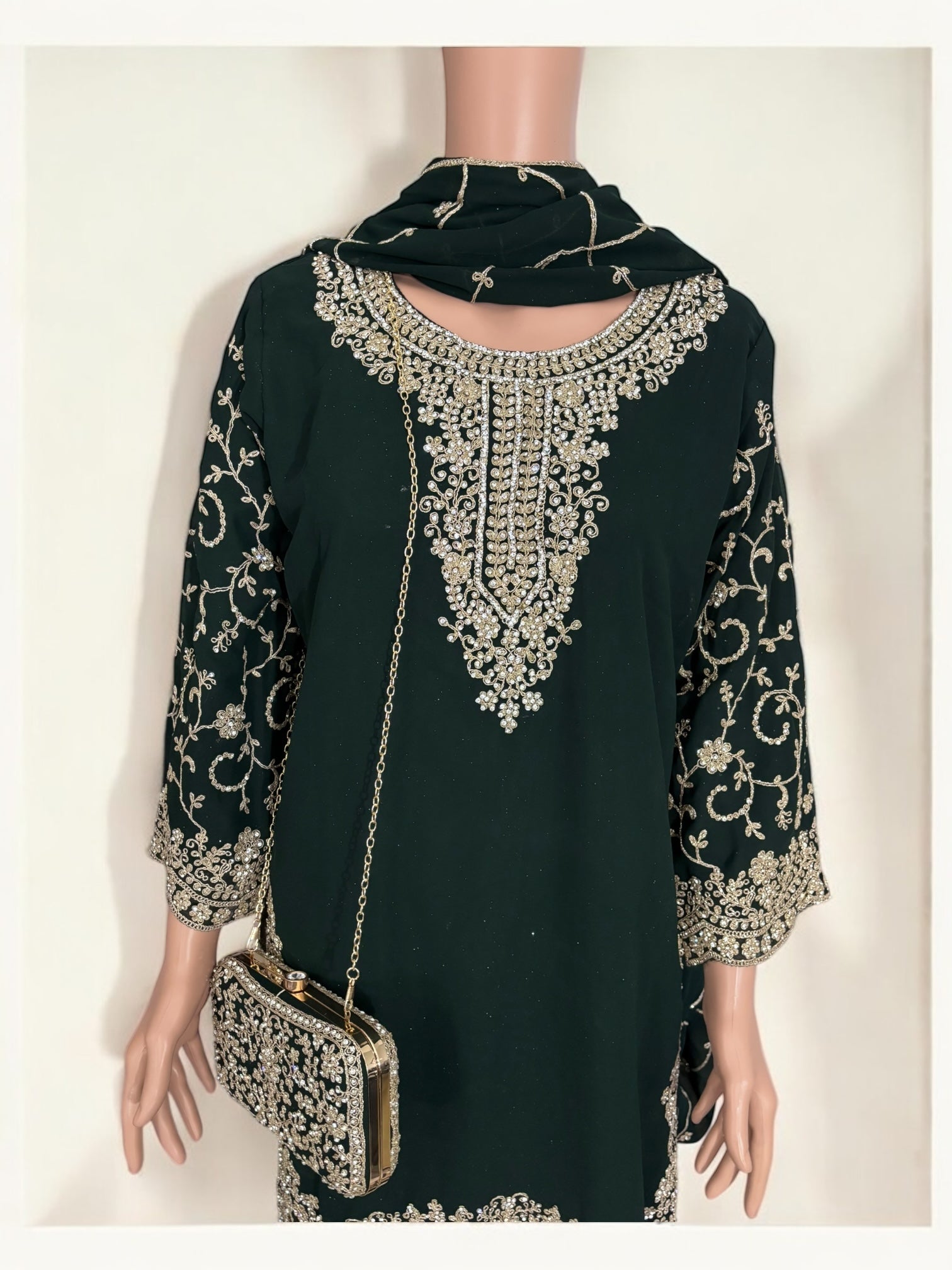 Green traditional designer Salwar Kameez suit with matching handbag, ethnic wear for women by Saree Ghor Charlotte.