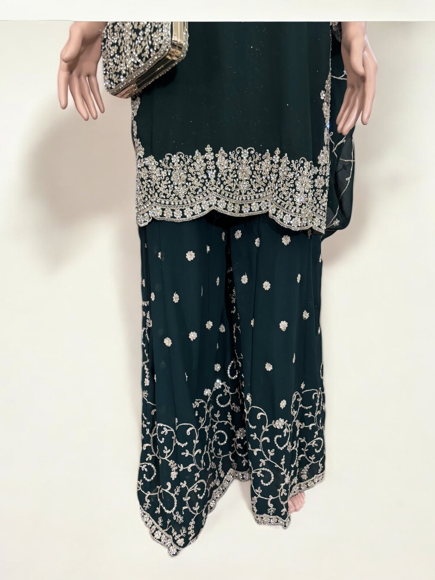 Green traditional designer Salwar Kameez suit with matching handbag, ethnic wear for women by Saree Ghor Charlotte.