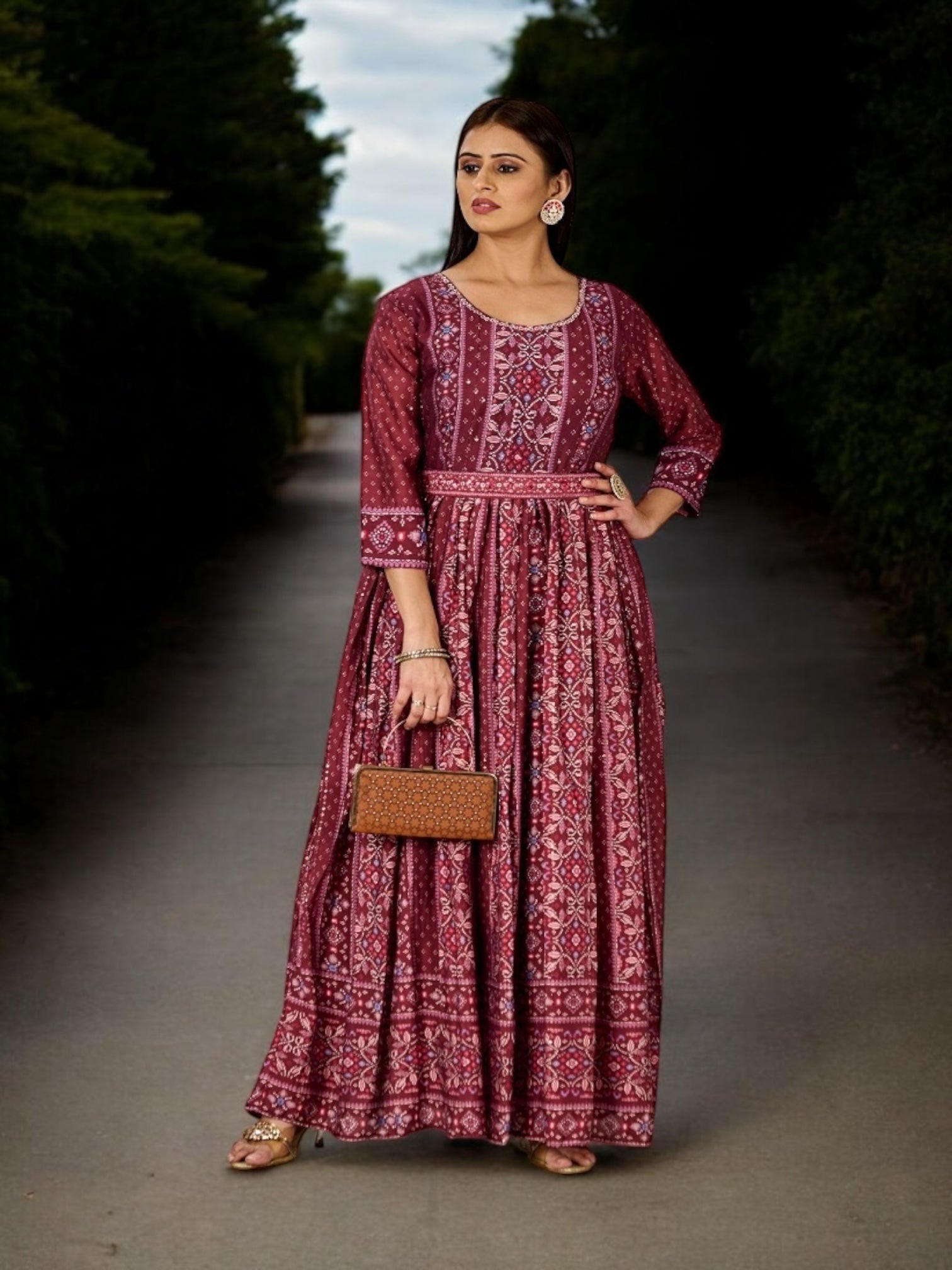 Maroon traditional designer salwar kameez for women by Saree Ghor Charlotte, featuring intricate ethnic embroidery and elegant fabric.