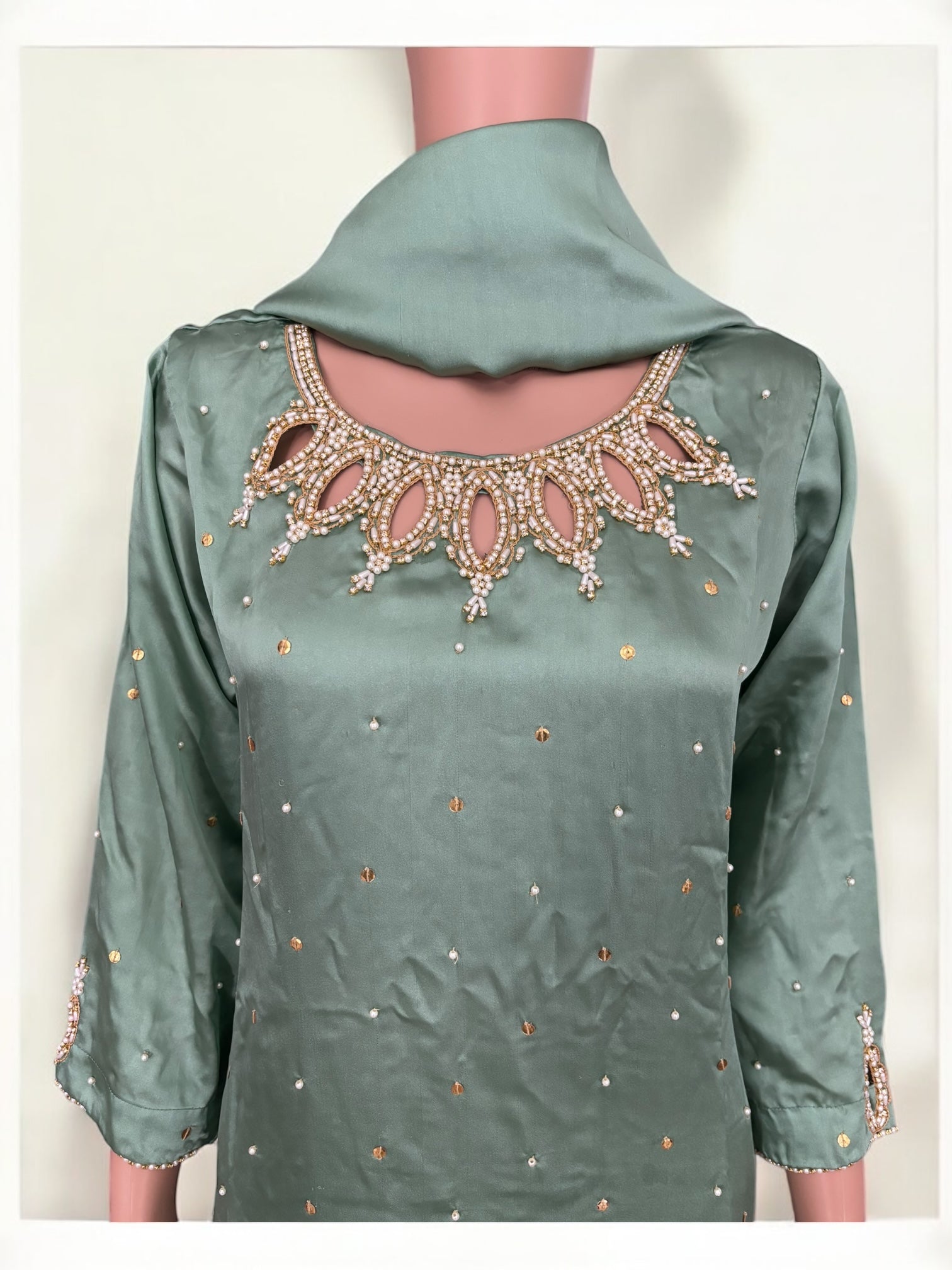Mint color traditional designer Salwar Kameez suit for women, showcasing intricate ethnic embroidery by Saree Ghor Charlotte.