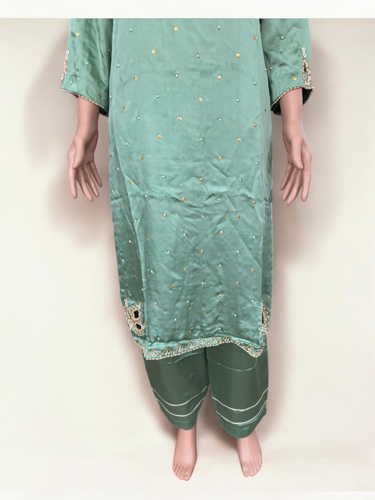 Mint color traditional designer Salwar Kameez suit for women by Saree Ghor Charlotte, showcasing intricate embroidery and ethnic style.