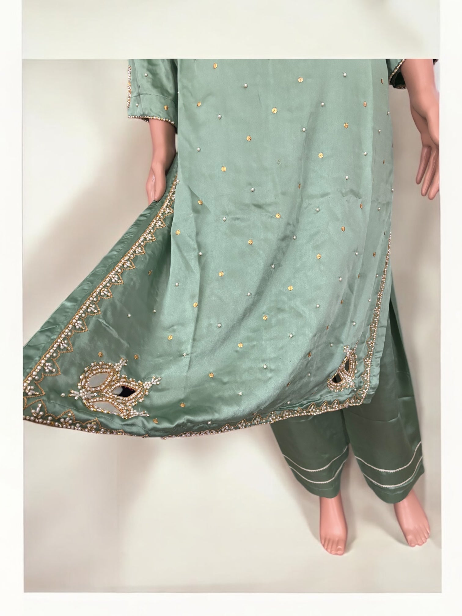 Mint color traditional designer Salwar Kameez suit for women, styled with intricate ethnic embroidery, by Saree Ghor Charlotte.