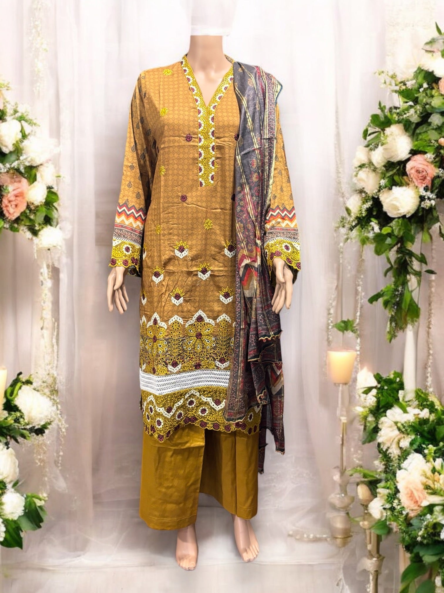 Pakistani traditional Salwar Kameez set by Saree Ghor Charlotte, featuring intricate embroidery and vibrant ethnic wear for women.
