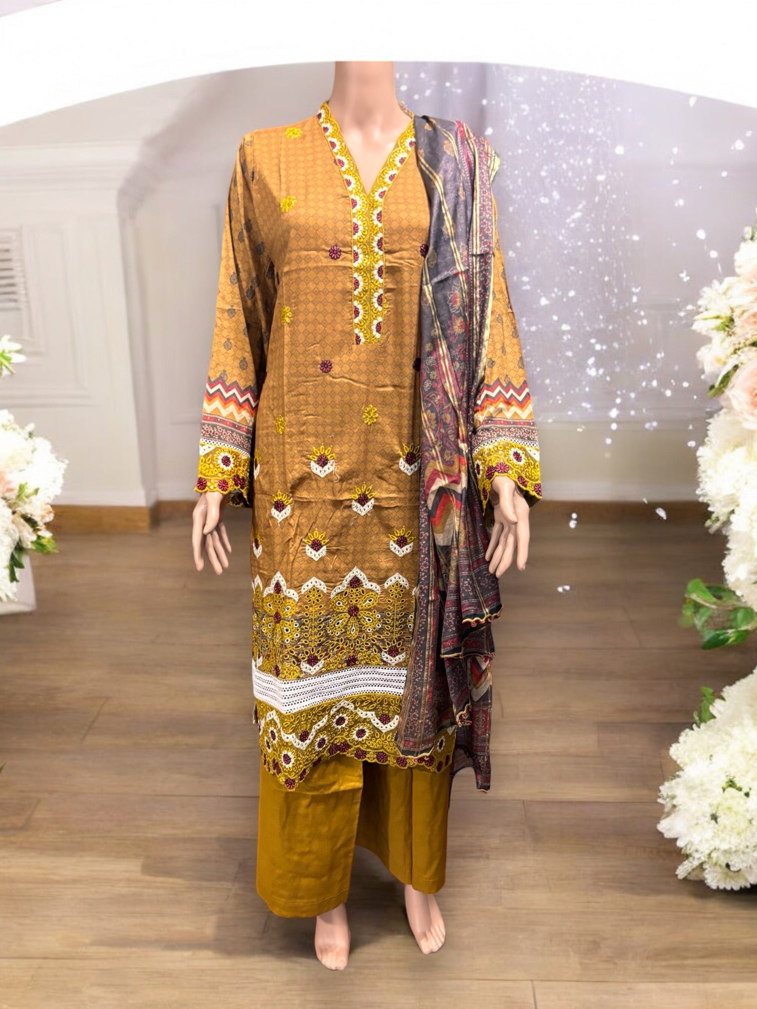 Pakistani traditional Salwar Kameez set by Saree Ghor Charlotte featuring intricate embroidery and elegant ethnic wear for women.