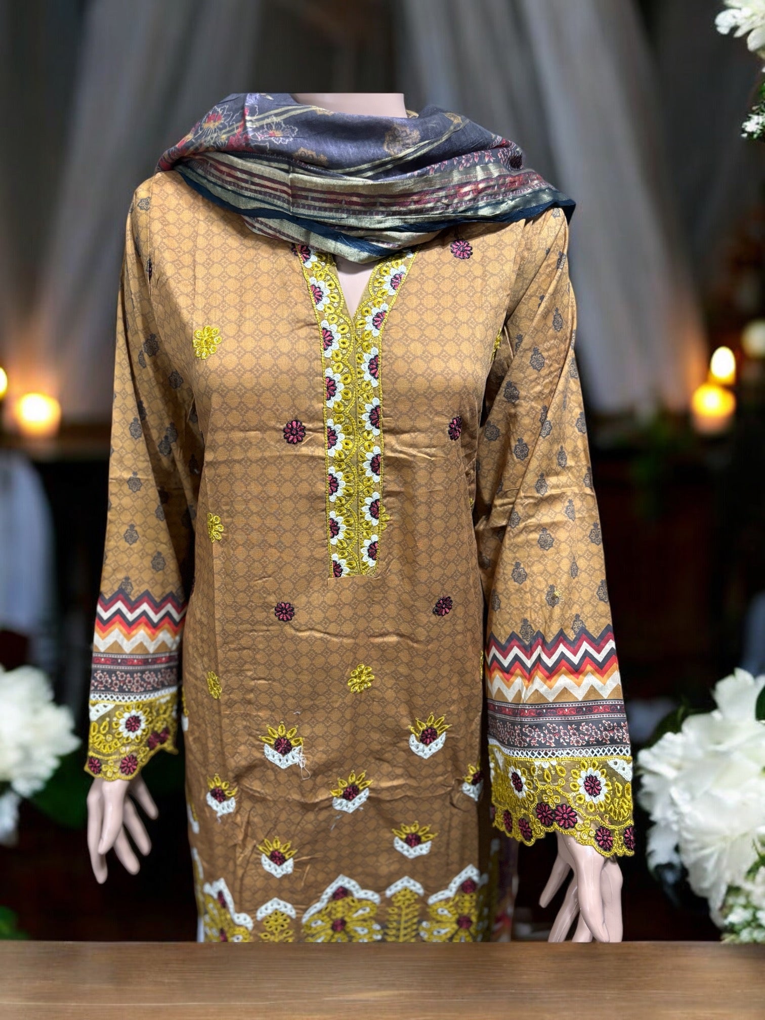 Pakistani traditional Salwar Kameez set by Saree Ghor Charlotte, featuring intricate embroidery and vibrant ethnic wear for women.