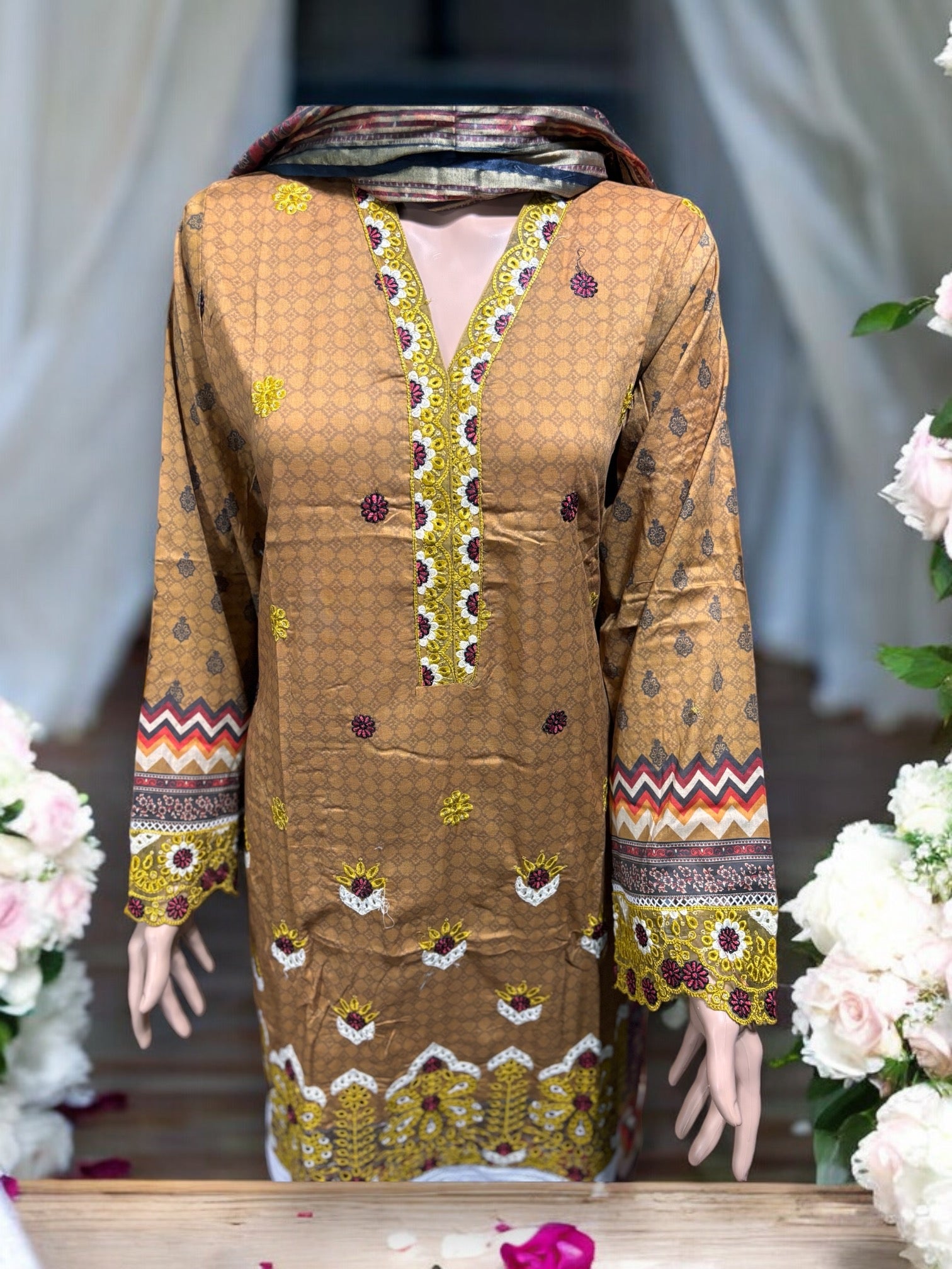 Pakistani traditional Salwar Kameez set by Saree Ghor Charlotte, featuring intricate design and vibrant ethnic wear for women.