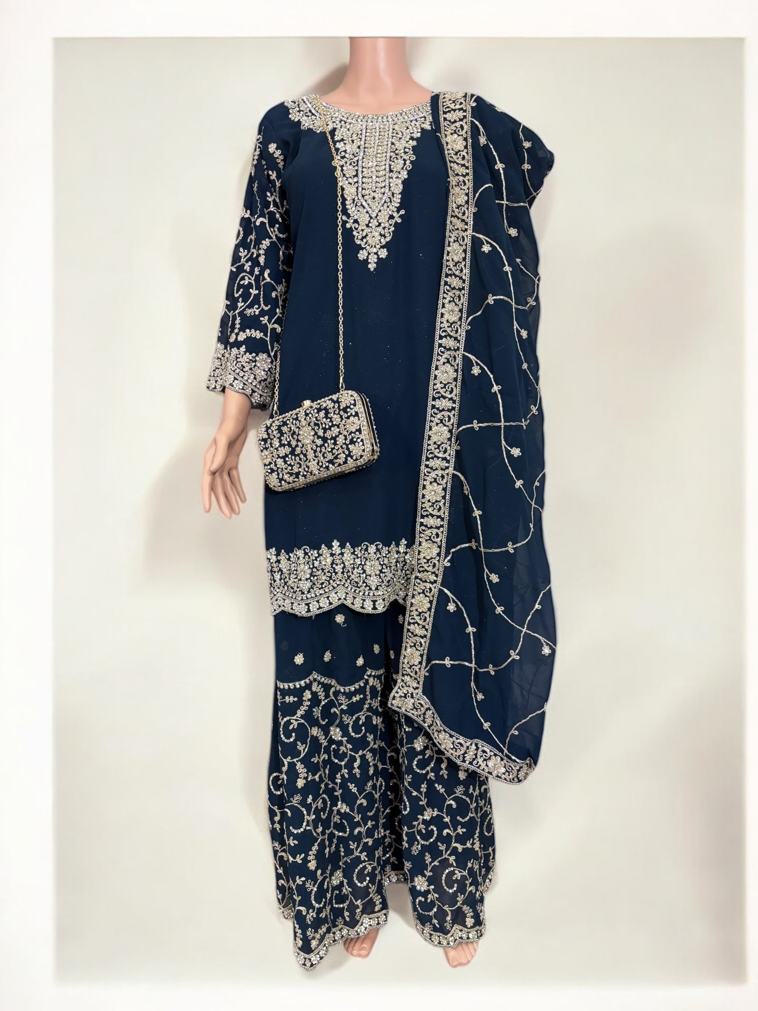 Navy blue traditional designer Salwar Kameez suit with matching handbag, ethnic wear for women by Saree Ghor Charlotte.