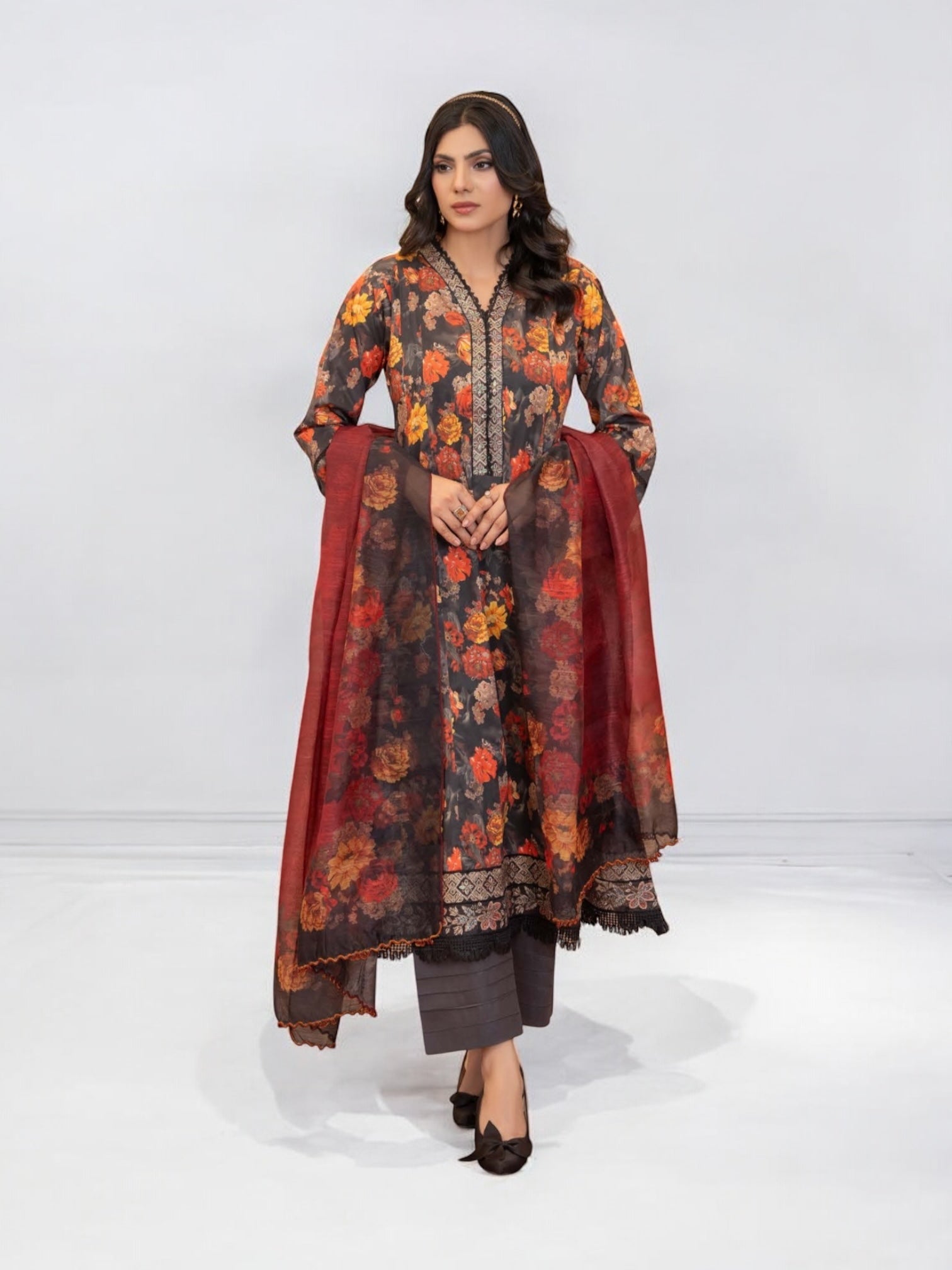Pakistani Salwar Kameez suit by Saree Ghor Charlotte, vibrant ethnic wear for women with intricate embroidery and traditional style.