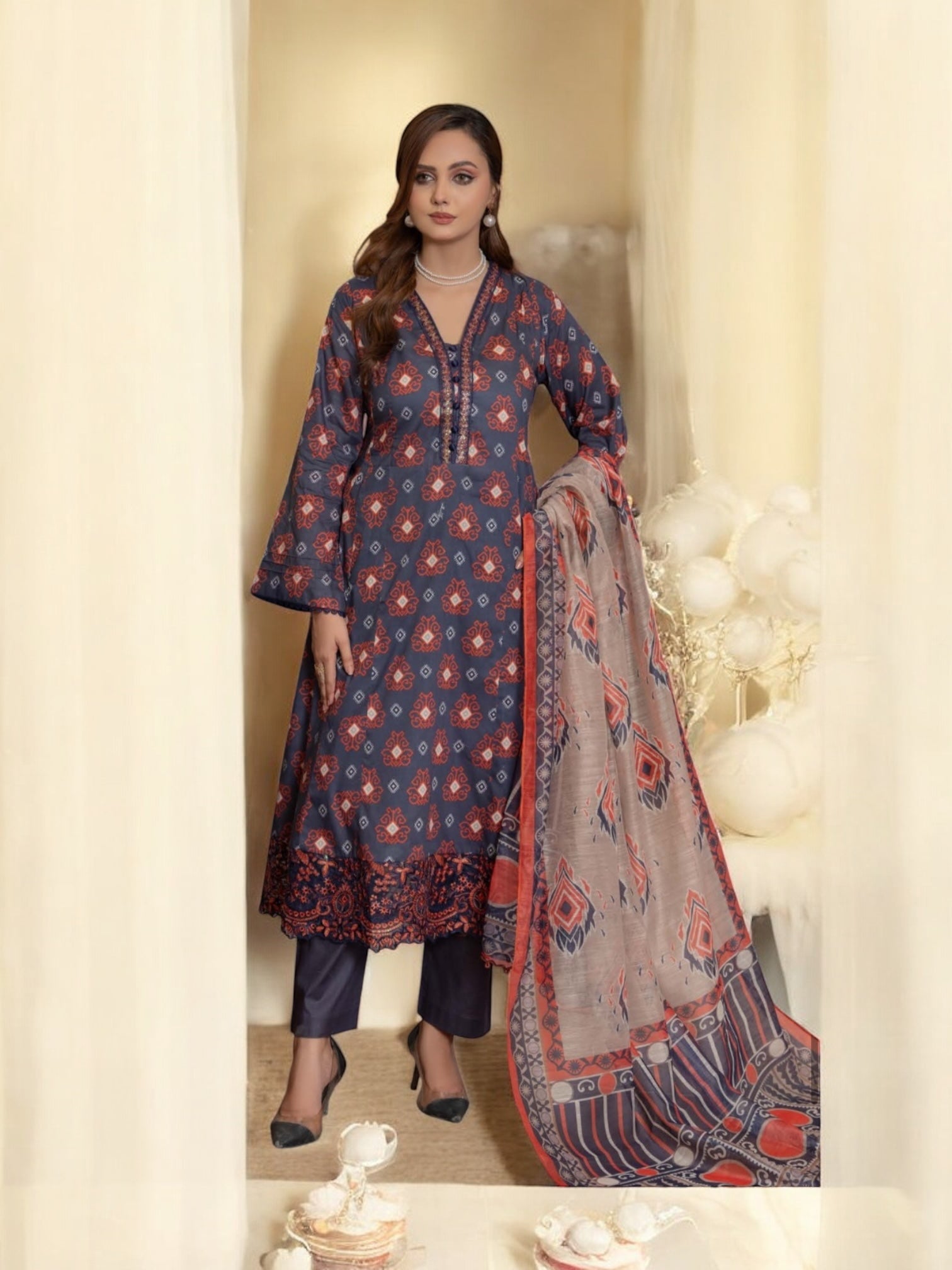 Pakistani Salwar Kameez suit from Saree Ghor Charlotte featuring traditional ethnic wear for women with vibrant fabric and intricate design.