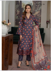 Pakistani Salwar Kameez Suit by Saree Ghor Charlotte, traditional ethnic wear for women, with intricate design and vibrant colors.