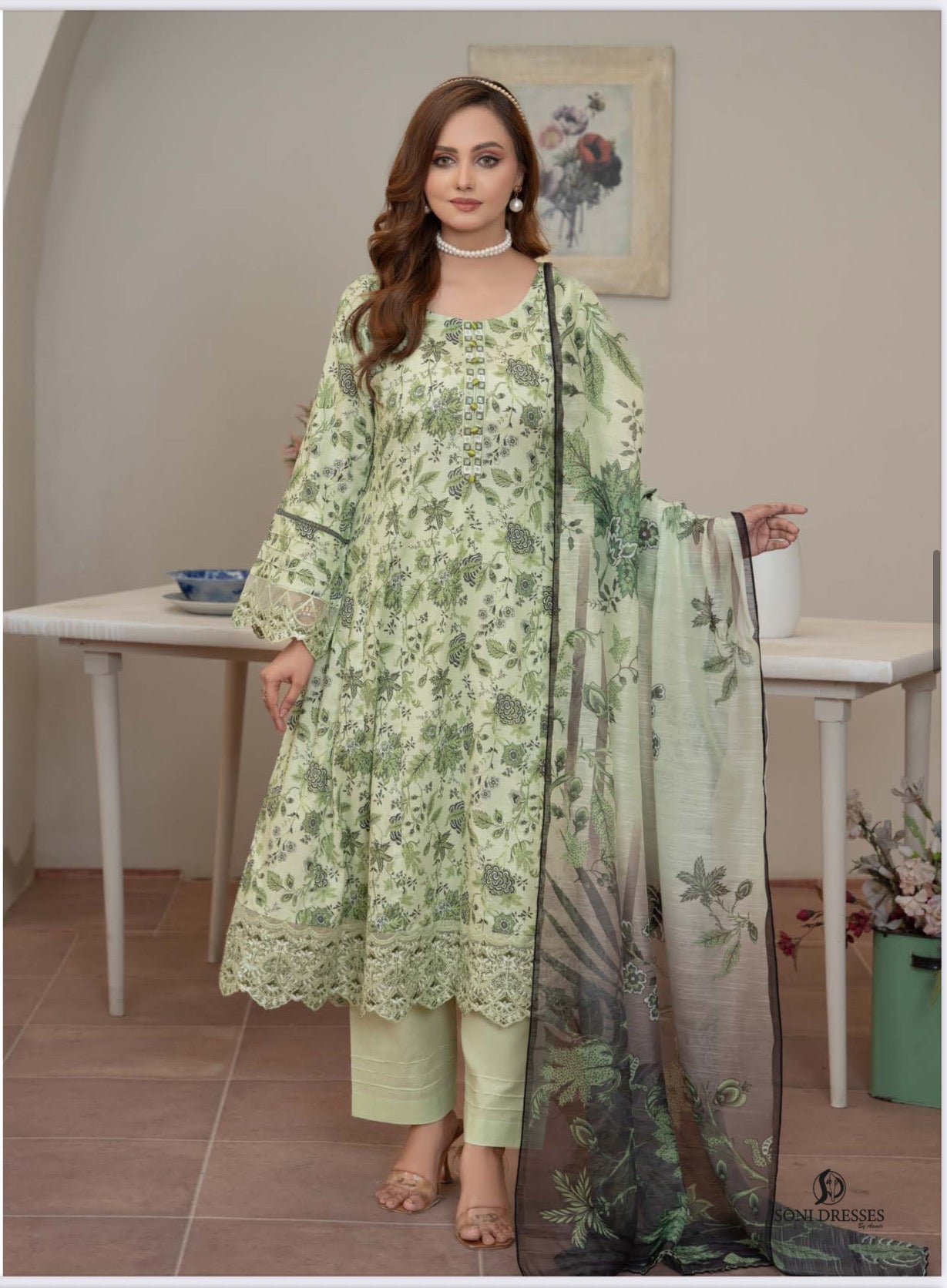 Pakistani Salwar Kameez suit by Saree Ghor Charlotte featuring traditional ethnic wear for women, with vibrant fabric and intricate design.