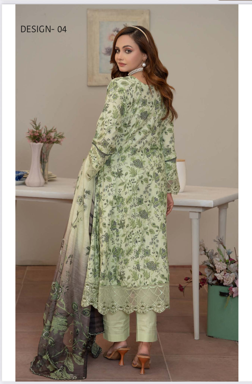 Pakistani Salwar Kameez suit by Saree Ghor Charlotte featuring vibrant ethnic wear for women, with intricate embroidery and traditional design.