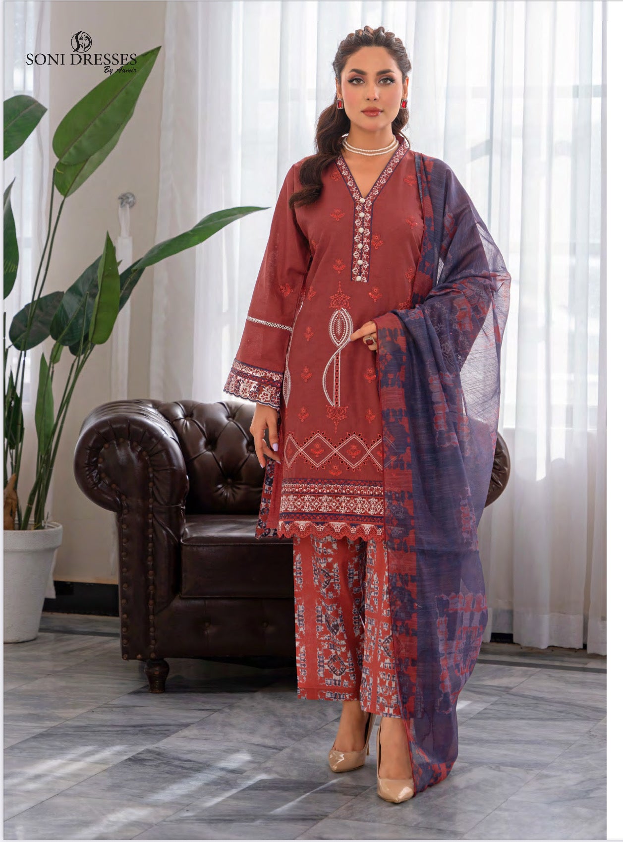 Pakistani Salwar Kameez suit by Saree Ghor Charlotte, traditional ethnic wear for women, featuring vibrant fabric and intricate embroidery.