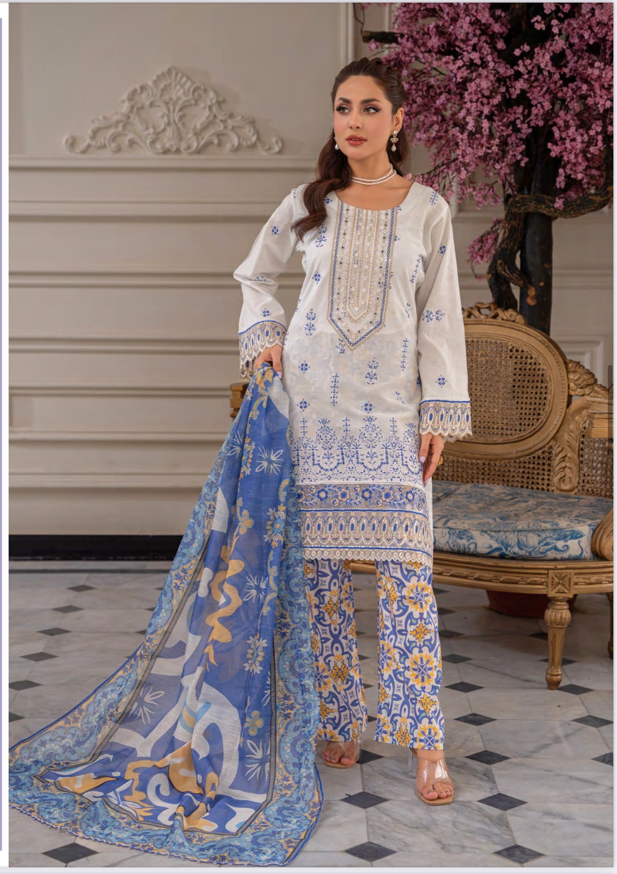 Pakistani Salwar Kameez suit by Saree Ghor Charlotte featuring traditional ethnic wear for women with vibrant fabric and intricate embroidery.