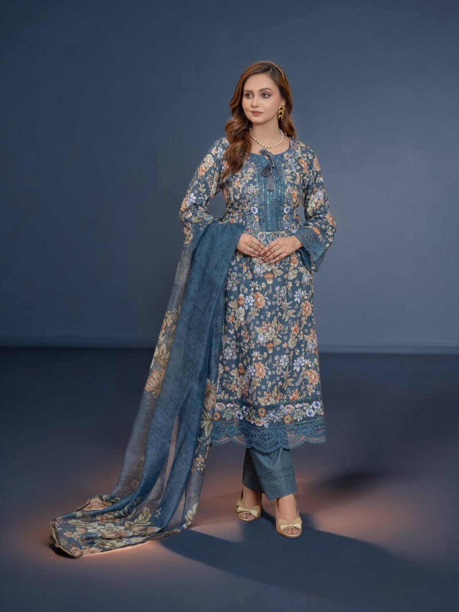 Pakistani Salwar Kameez suit by Saree Ghor Charlotte featuring vibrant ethnic wear for women, with intricate patterns and traditional style.