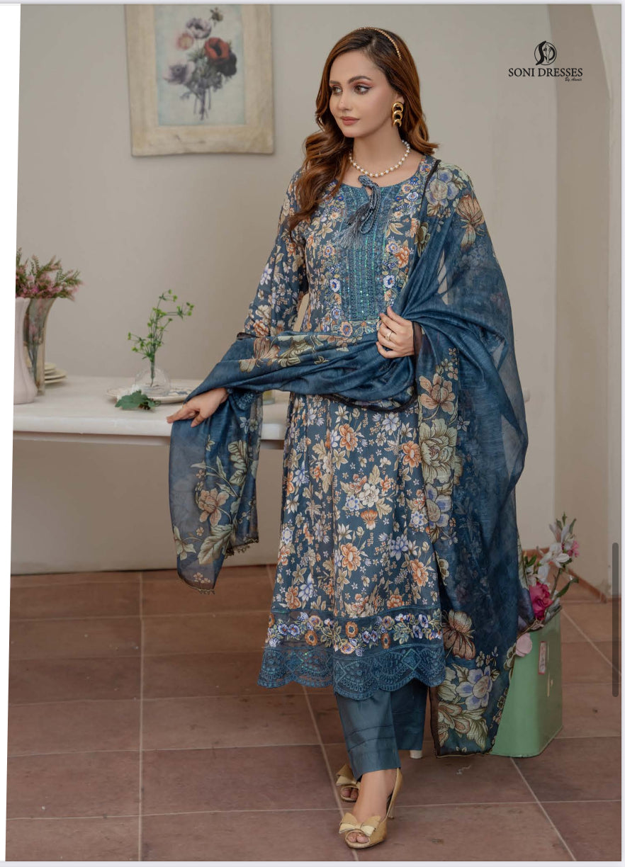 Pakistani Salwar Kameez suit by Saree Ghor Charlotte, traditional ethnic wear for women with intricate embroidery and vibrant fabric.