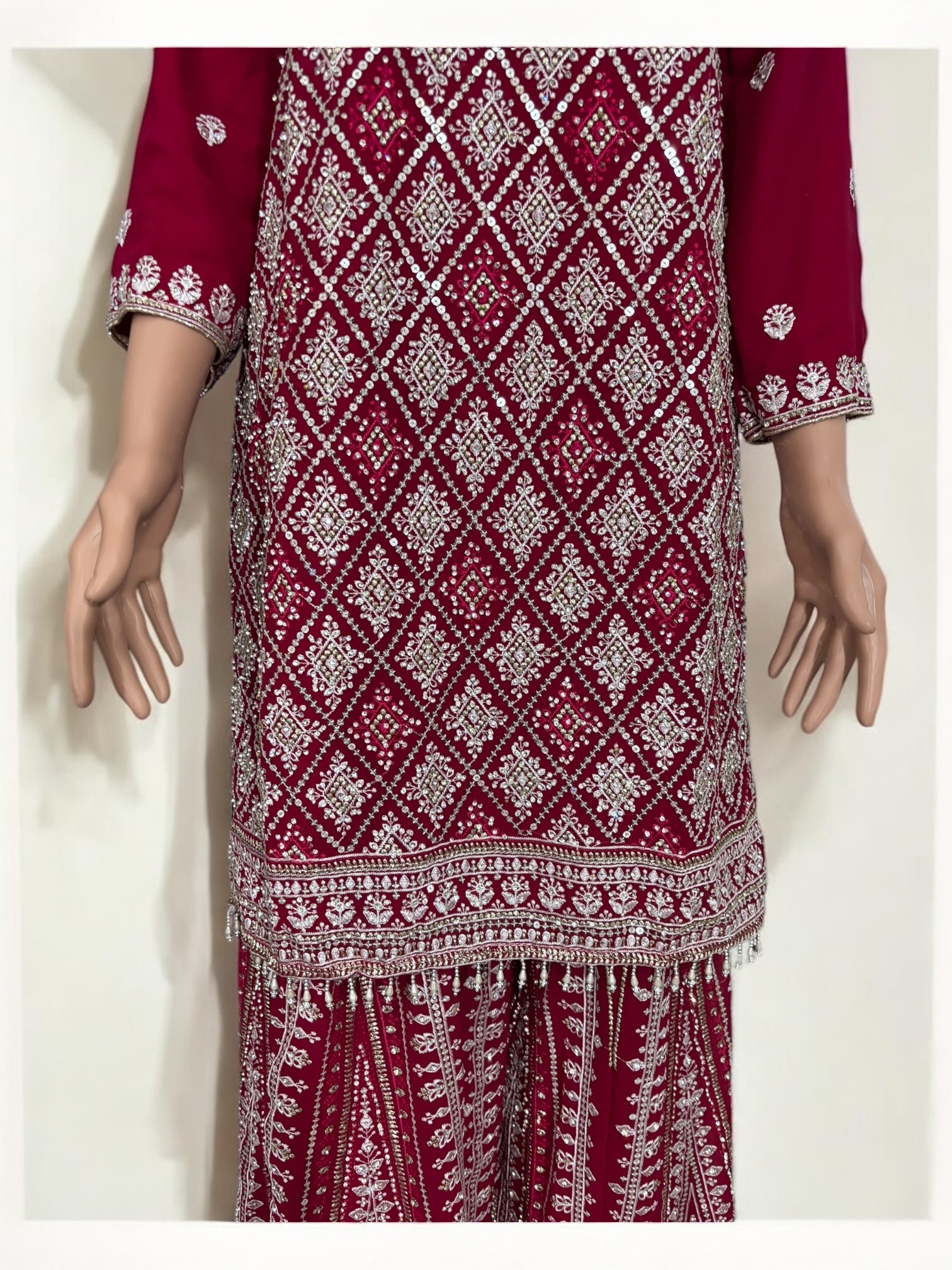 Rani Pink traditional designer Salwar Kameez suit by Saree Ghor Charlotte, showcasing intricate embroidery and elegant ethnic wear for women.