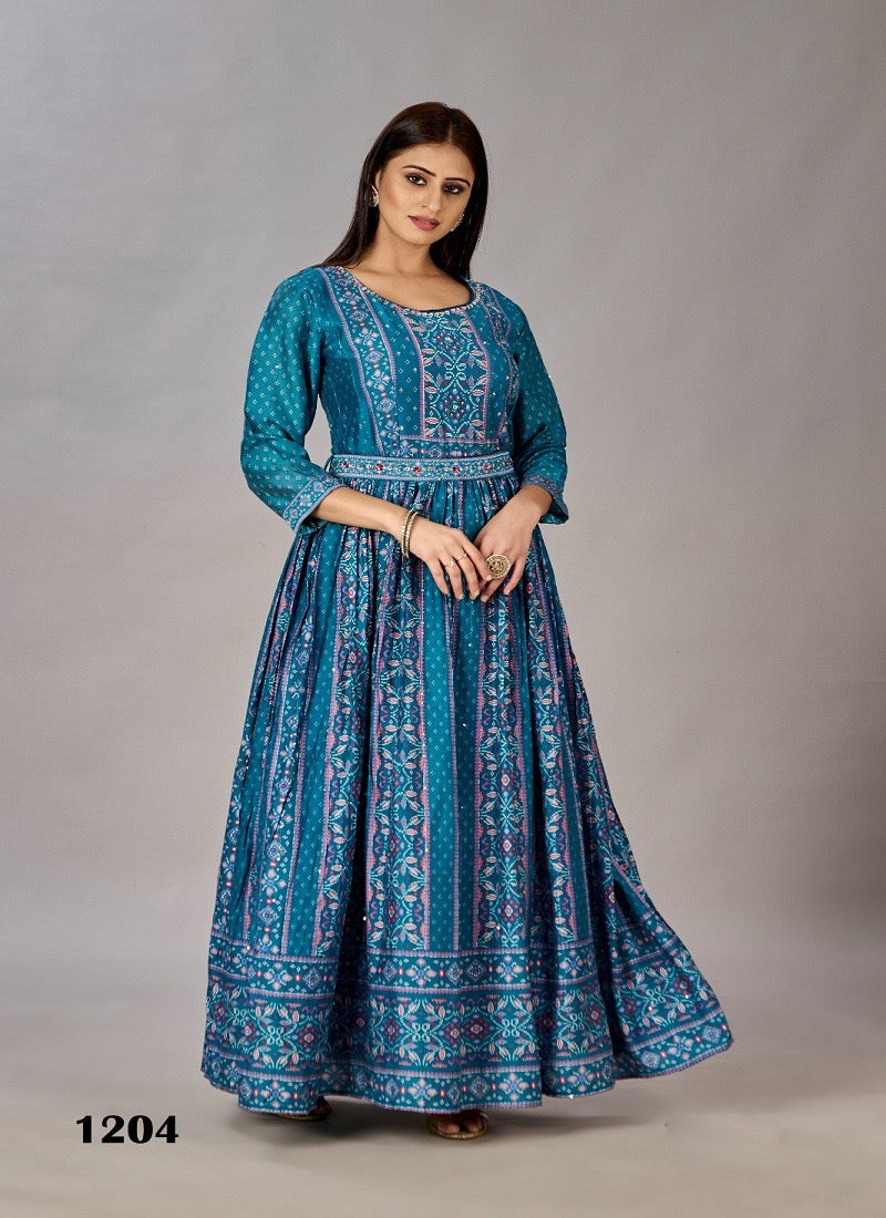 Teal blue traditional designer Salwar Kameez gown for women, ethnic wear by Saree Ghor Charlotte, showcasing intricate patterns and fabric details.