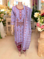Traditional cotton designer salwar kameez suit for women, featuring intricate ethnic embroidery and vibrant colors.