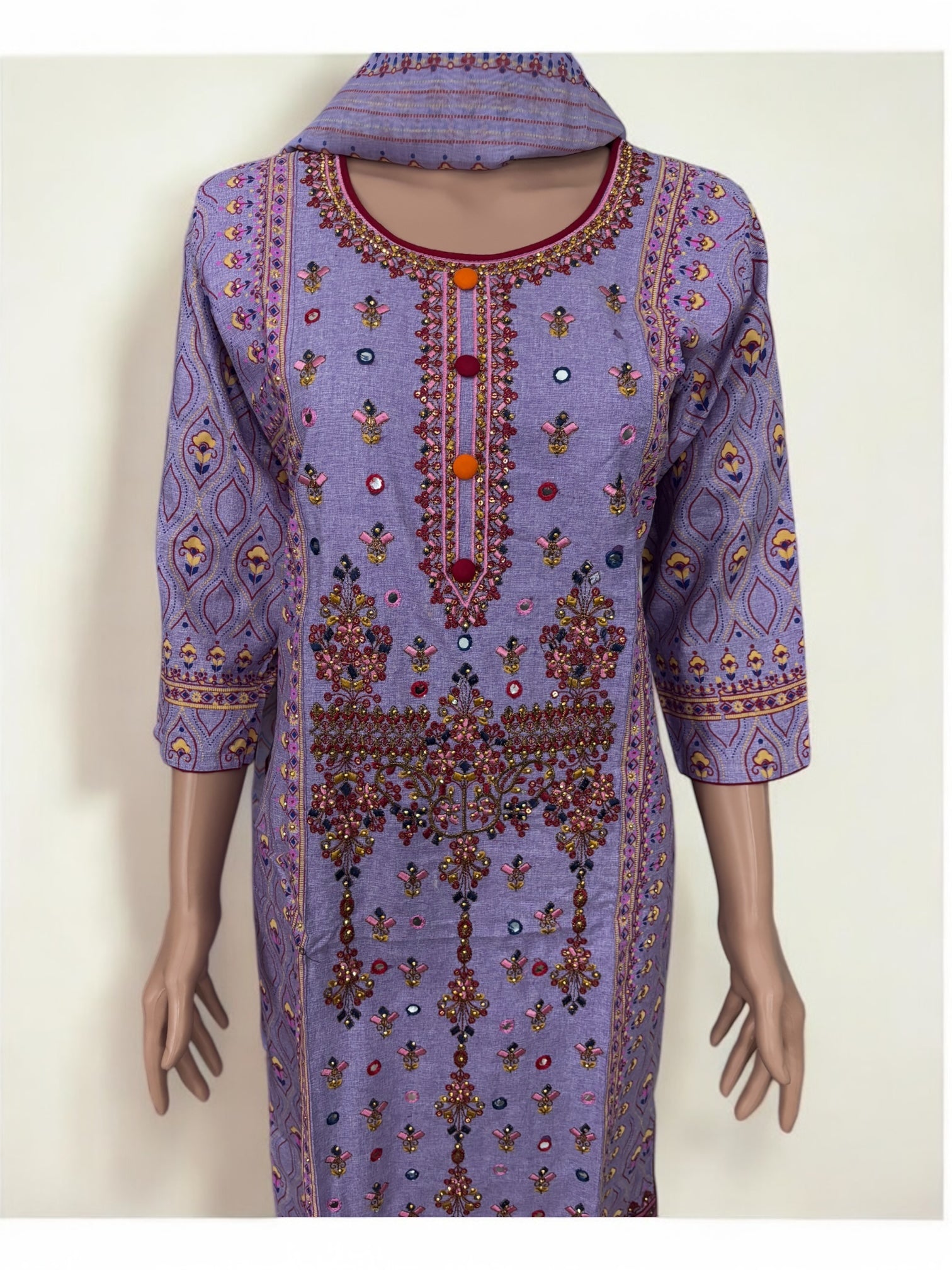 Traditional cotton designer Salwar Kameez suit for women, featuring intricate ethnic embroidery and vibrant colors.