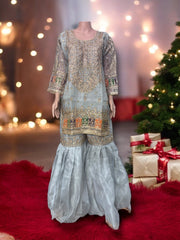 Traditional designer Gharara Salwar Kameez set by Saree Ghor Charlotte, ethnic wear for women with intricate design and vibrant fabric.