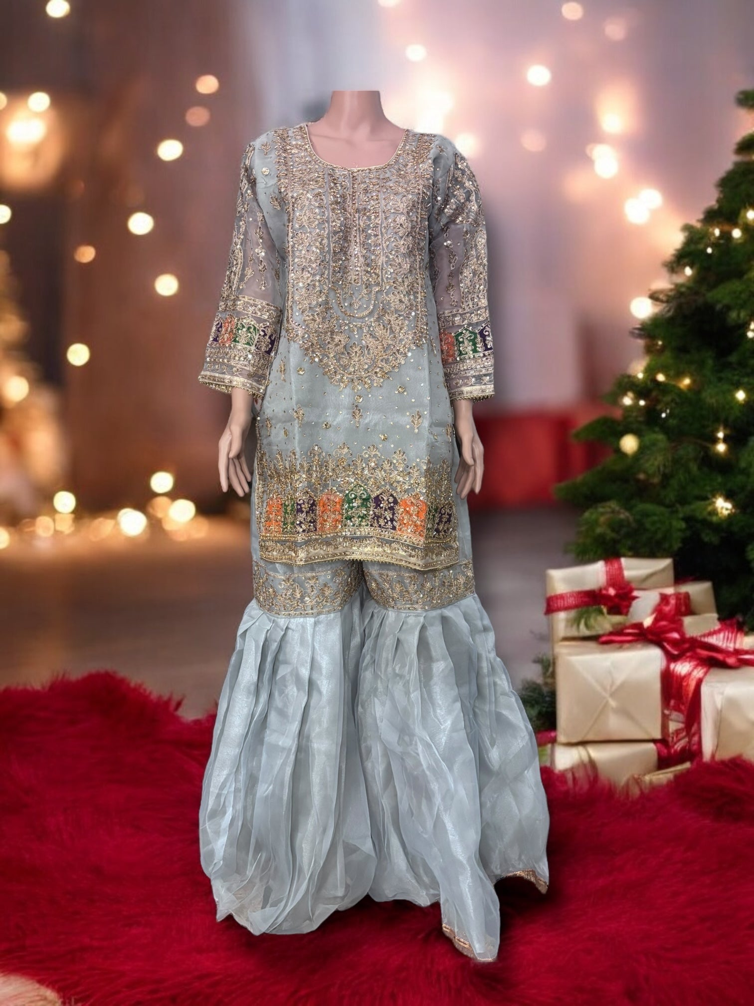 Traditional designer Gharara Salwar Kameez set by Saree Ghor Charlotte, ethnic wear for women with intricate design and vibrant fabric.