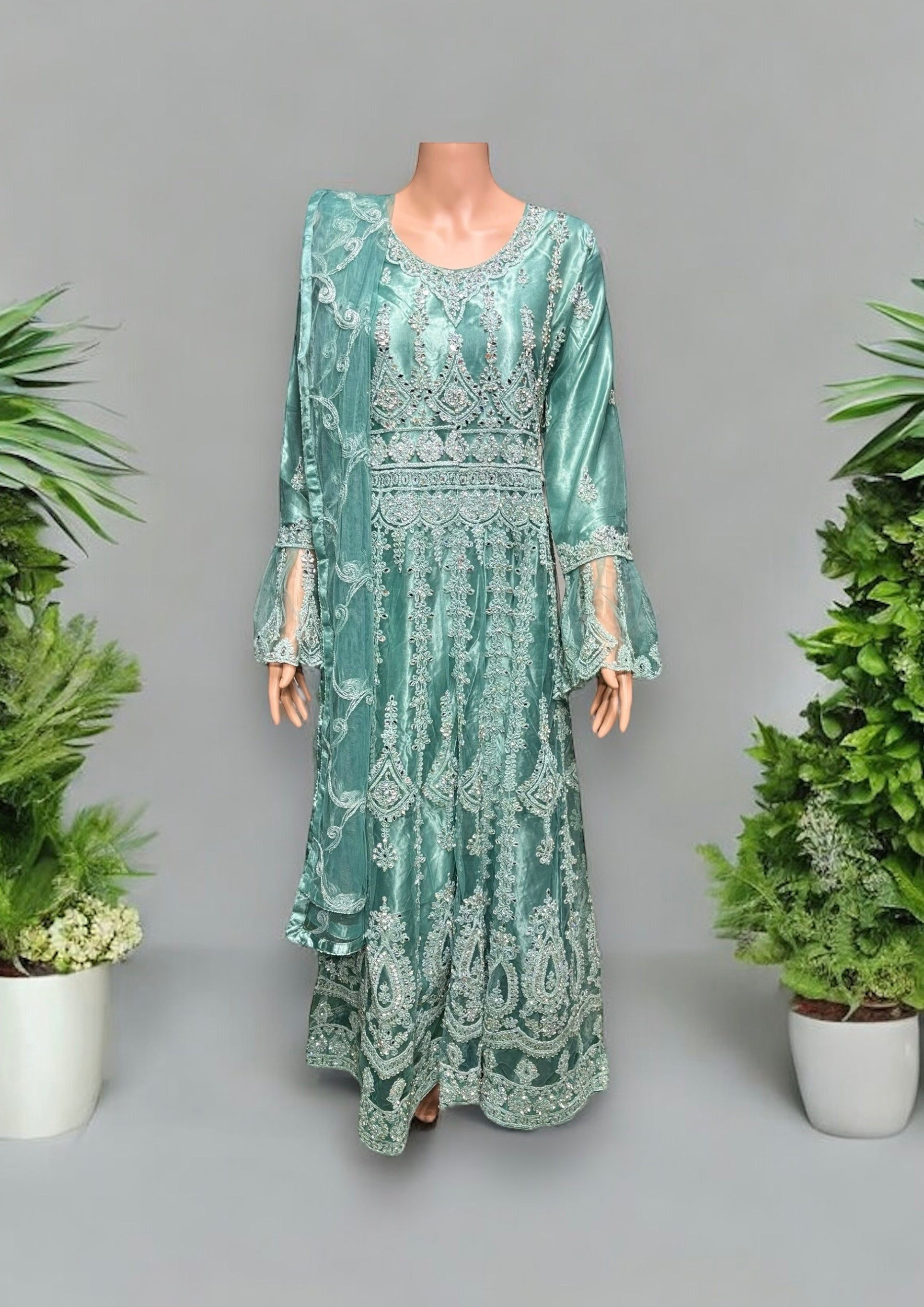 Traditional designer maxi gown salwar kameez for women by Saree Ghor Charlotte, featuring intricate ethnic embroidery and flowing fabric.