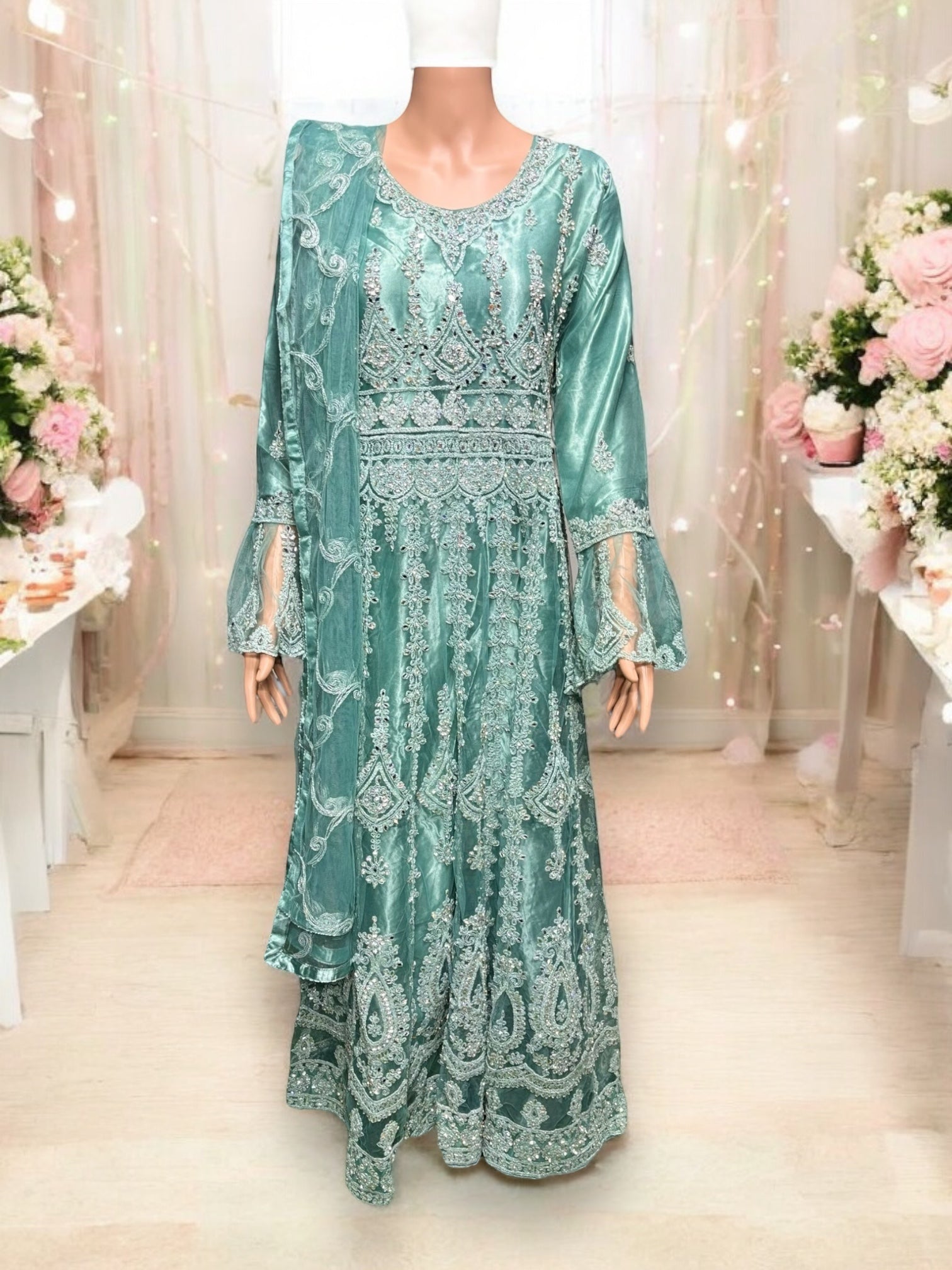 Traditional designer maxi gown salwar kameez for women by Saree Ghor Charlotte, showcasing intricate ethnic embroidery and flowing fabric.