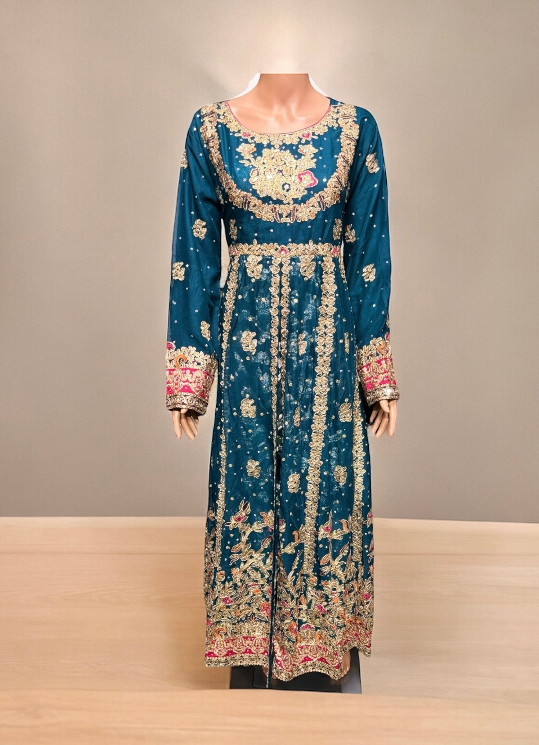 Traditional designer maxi gown for women by Saree Ghor Charlotte, featuring intricate ethnic embroidery and flowing fabric.