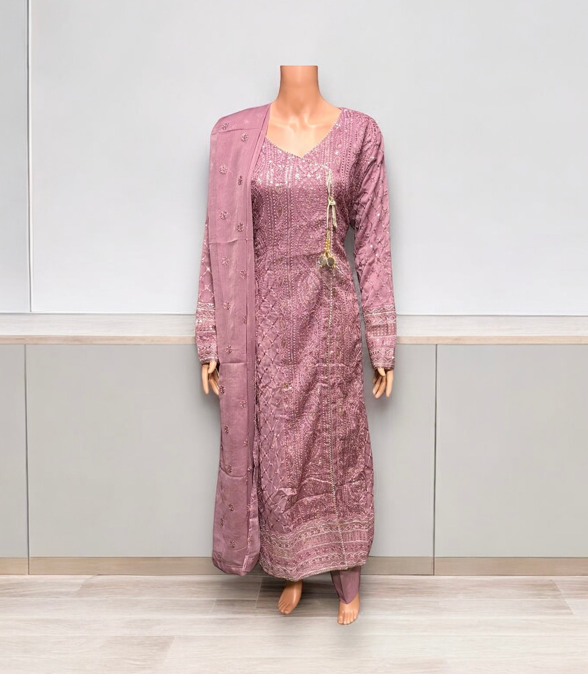 Traditional designer Salwar Kameez set by Saree Ghor Charlotte, featuring intricate embroidery and vibrant fabric for women’s ethnic wear.