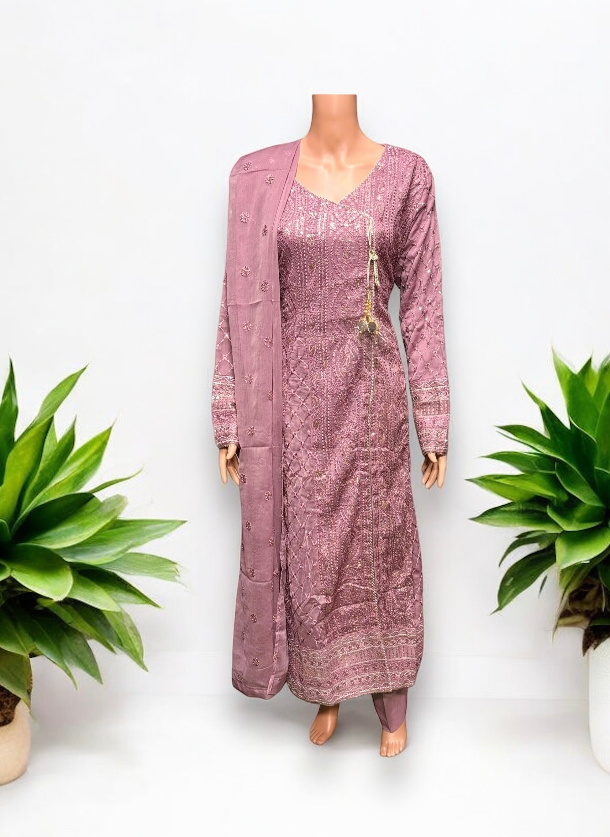 Traditional designer party wear Salwar Kameez set by Saree Ghor Charlotte, featuring intricate embroidery and vibrant fabric for women.
