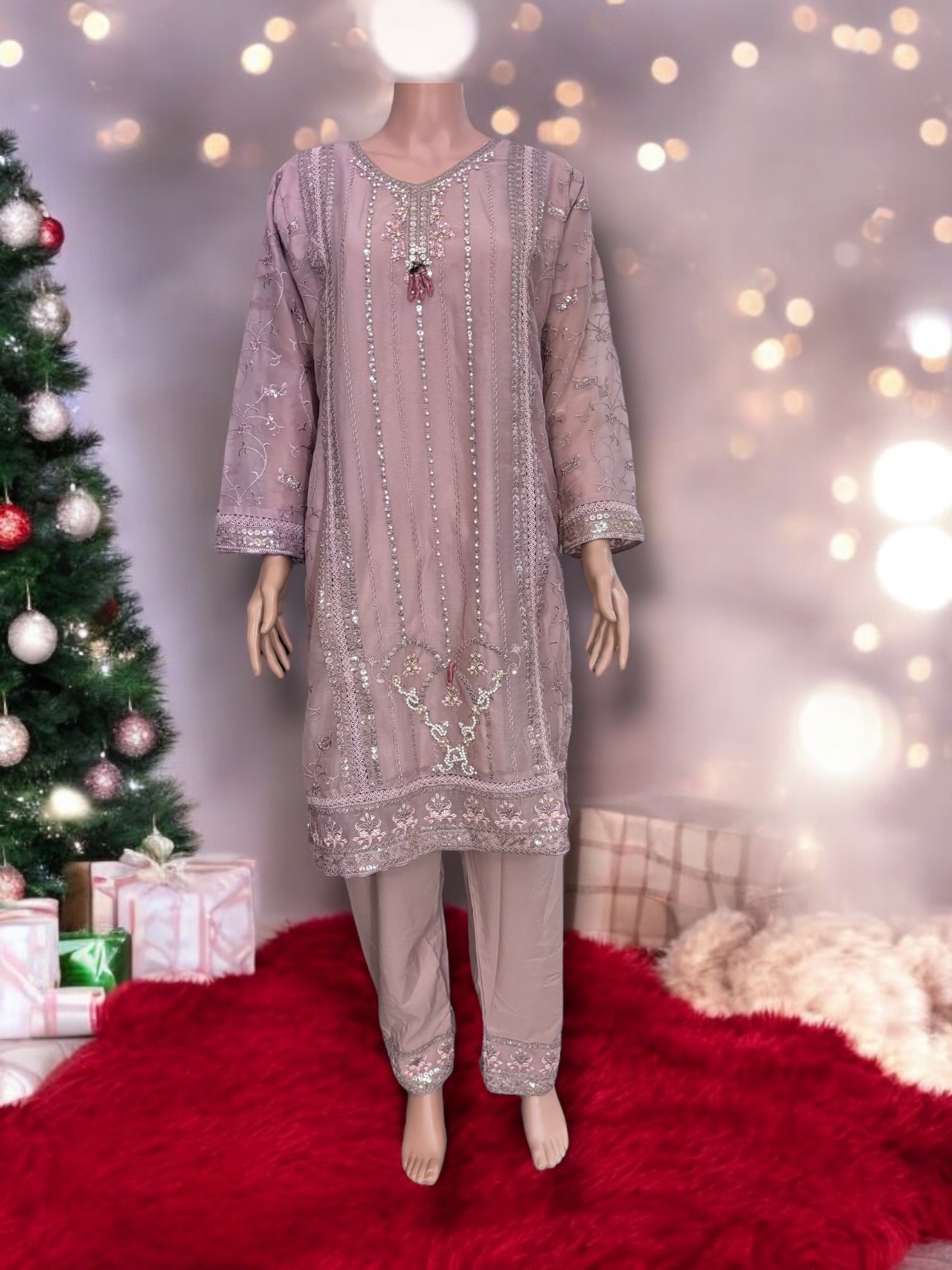 Traditional designer Salwar Kameez set by Saree Ghor Charlotte featuring intricate embroidery and vibrant fabric for women's ethnic wear.