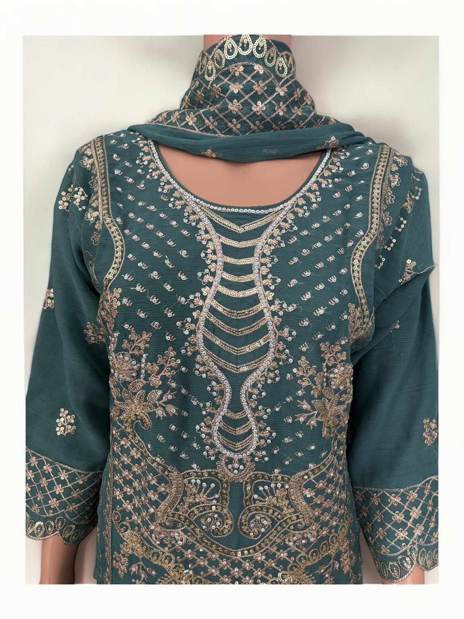 Traditional designer Salwar Kameez suit by Saree Ghor Charlotte featuring intricate ethnic embroidery for women.