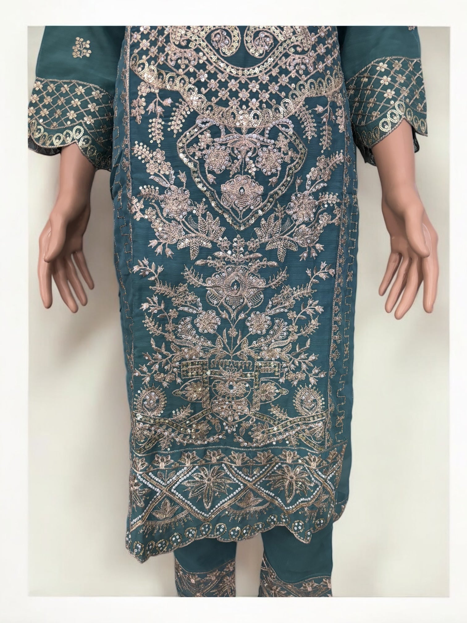 Traditional designer Salwar Kameez suit by Saree Ghor Charlotte, ethnic women's wear with intricate patterns and vibrant fabric.