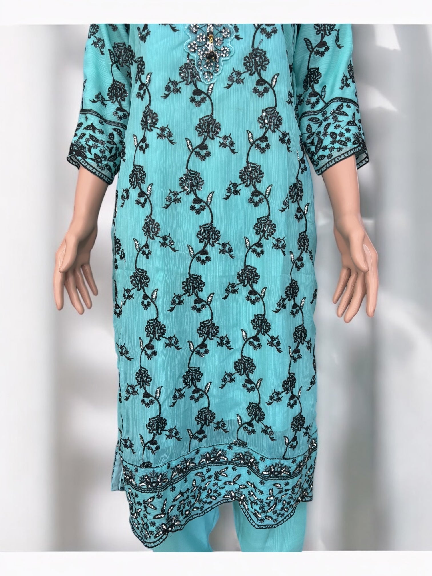 Traditional Saree Ghor Charlotte Salwar Kameez suit for women, featuring intricate ethnic designs and vibrant fabric.