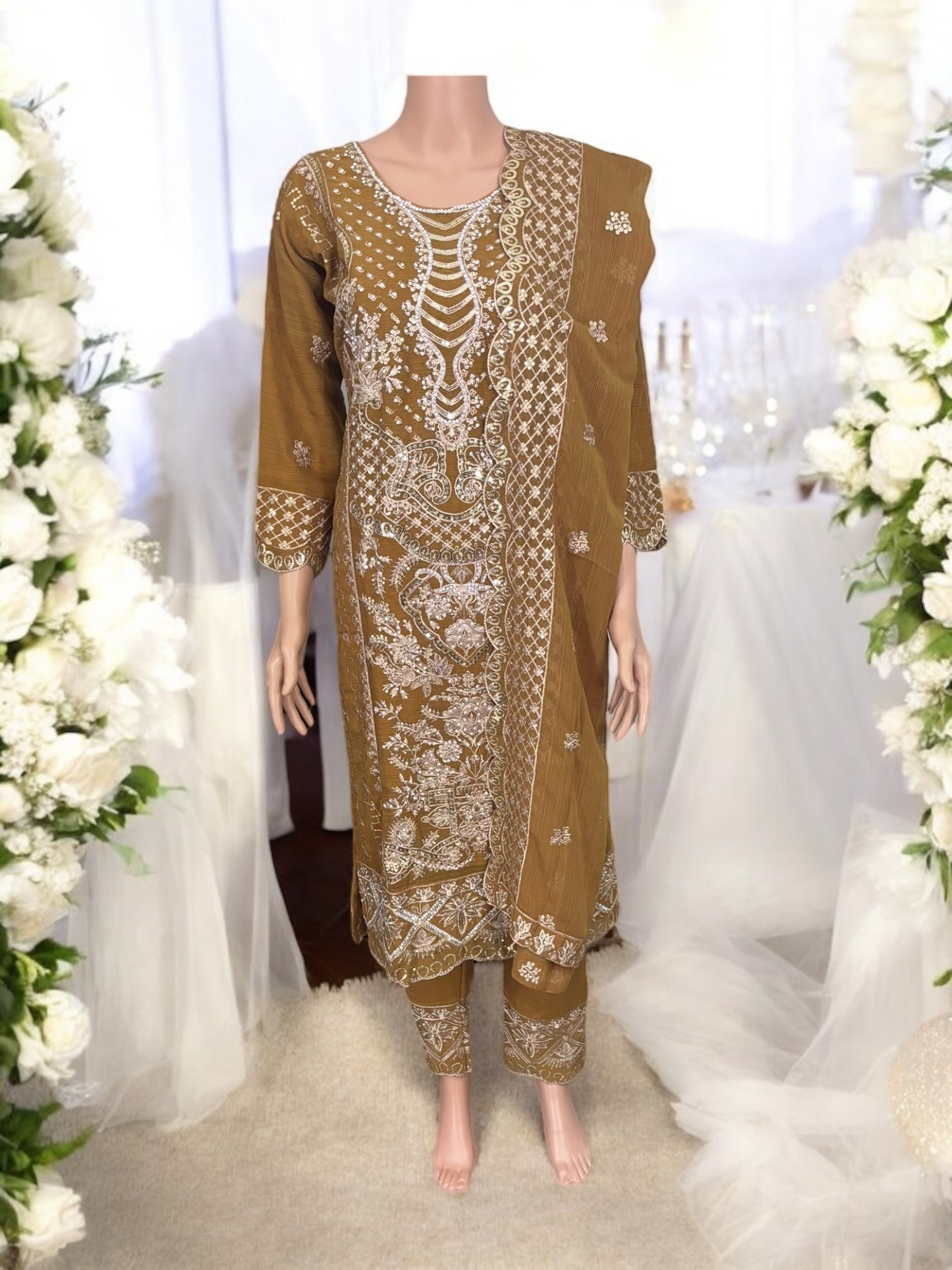 Traditional designer Salwar Kameez suit by Saree Ghor Charlotte featuring intricate embroidery and vibrant ethnic wear for women.