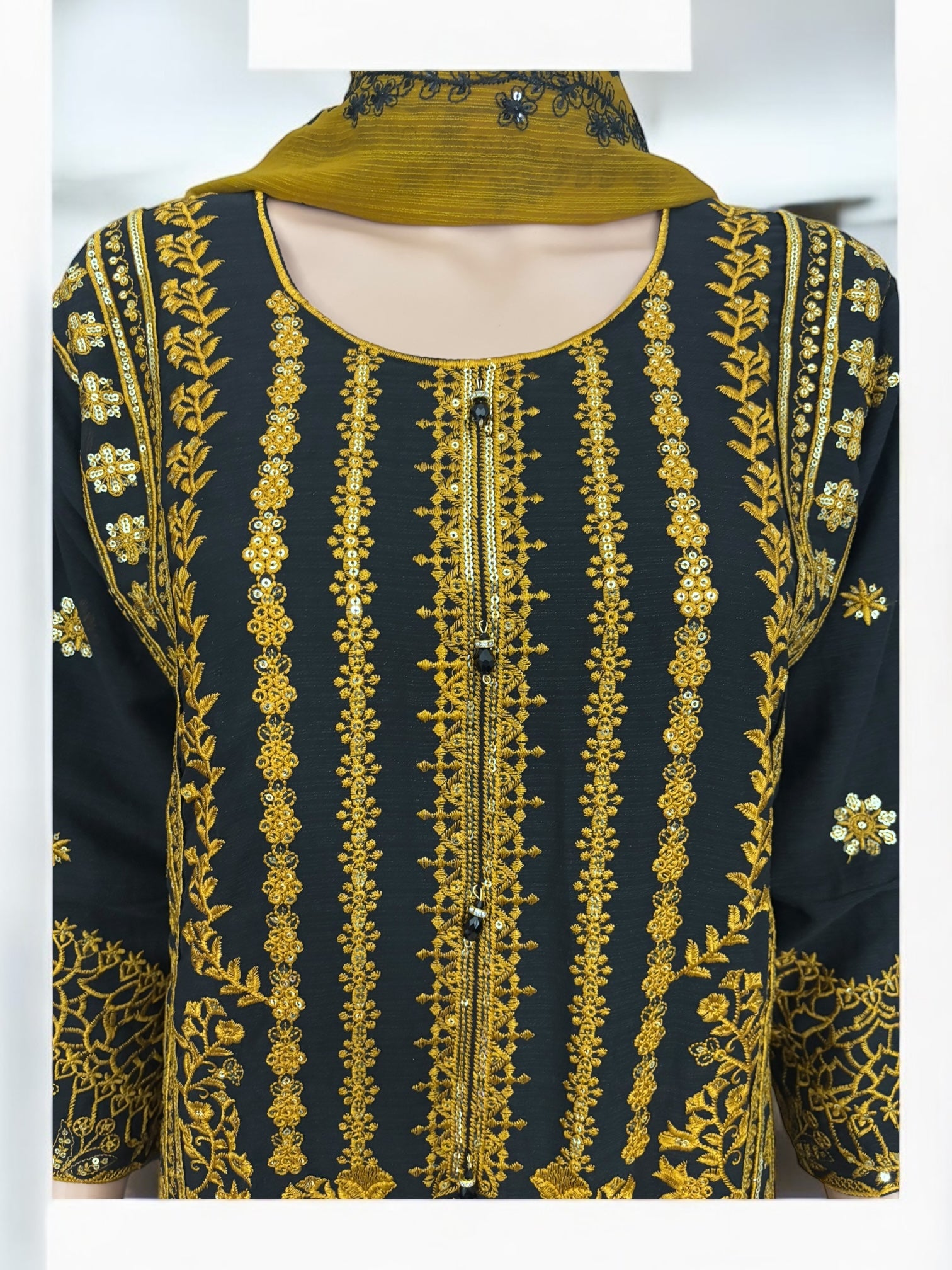 Traditional designer Salwar Kameez suit by Saree Ghor Charlotte, showcasing intricate embroidery and vibrant ethnic wear for women.