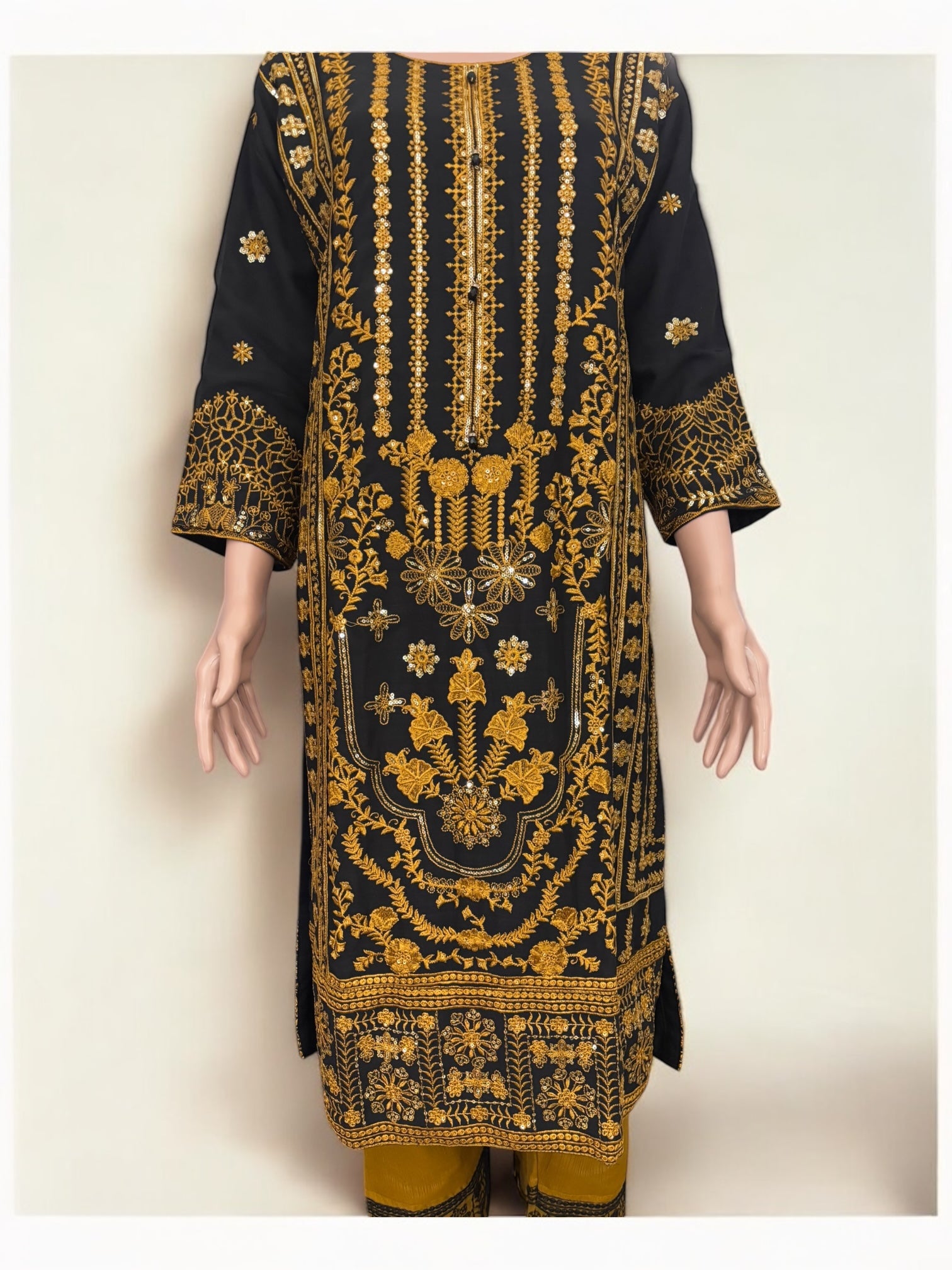 Traditional designer Salwar Kameez suit by Saree Ghor Charlotte featuring intricate embroidery and elegant ethnic wear for women.